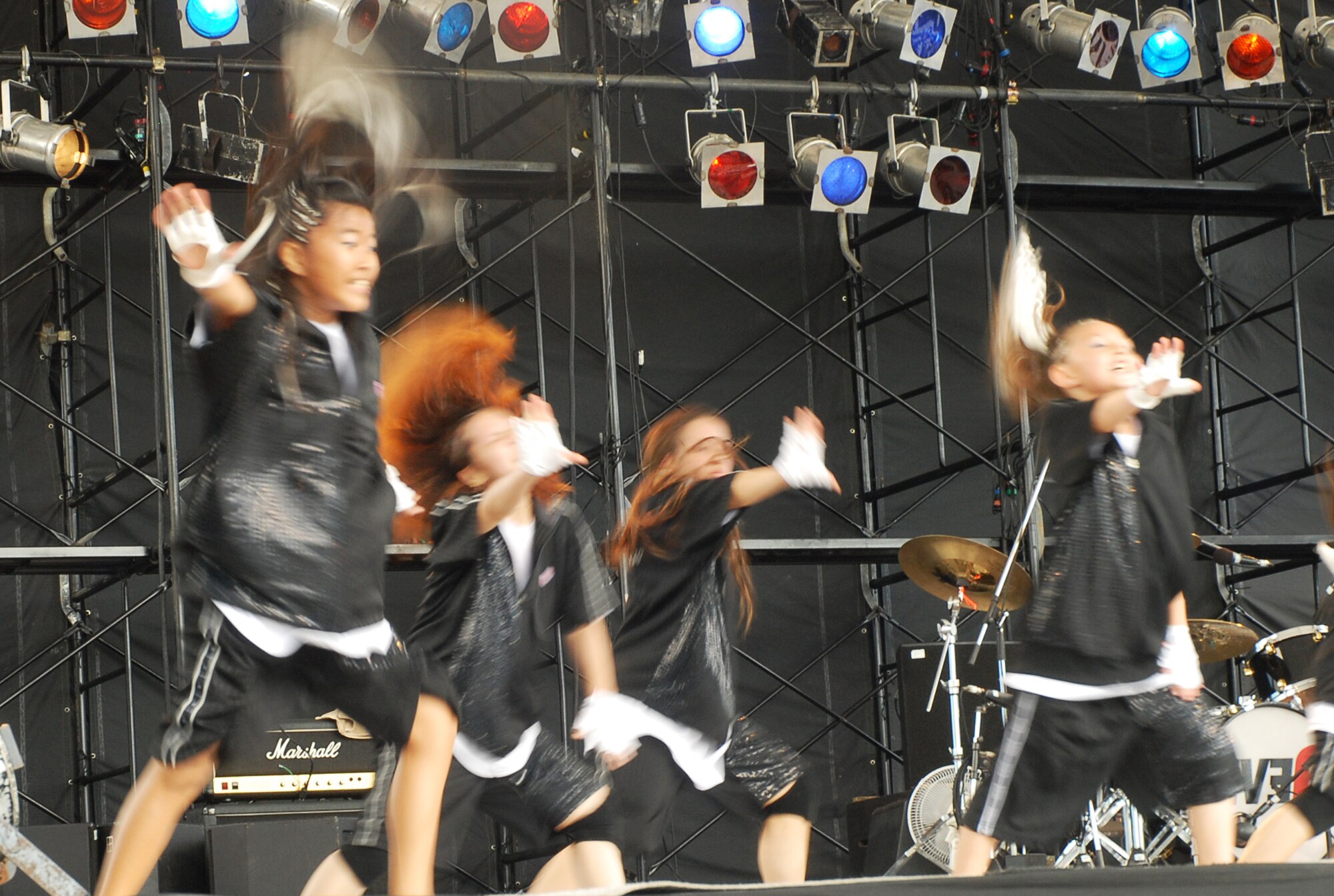 Members of the T-Da Dancers perform during Kadena Air Base’s AmericaFest open house July 5, 2008. The group was one of many entertainers that performed throughout the festival. Headlining the festival was rock group Eve 6. AmericaFest featured two dozen aircraft static displays, live entertainment, activities for children, and a nightly fireworks show. The two-day event, which was designed to strengthen relations with the base’s Okinawan neighbors, drew nearly 66,000 people.  (U.S. Air Force photo/Airman Chad Warren)
