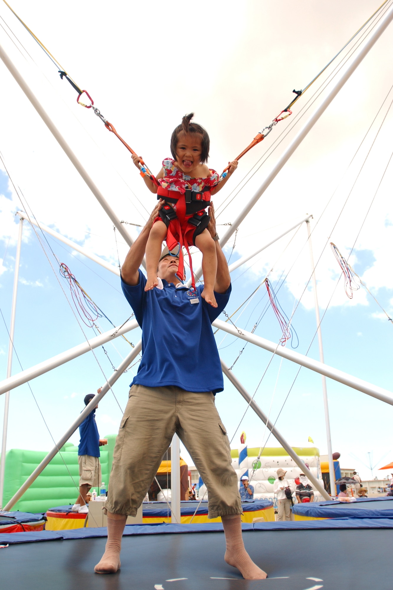 Tomoka Tamaki, 3, enjoys the bungee jump, one of many activities offered in Kiddie Land during Kadena Air Base’s AmericaFest open house July 5, 2008. AmericaFest featured two dozen aircraft static displays, live entertainment, activities for children and a nightly fireworks show. The two-day event, which was designed to strengthen relations with the base's Okinawan neighbors, drew nearly 66,000 people.
(U.S. Air Force photo/Tech. Sgt. Rey Ramon)