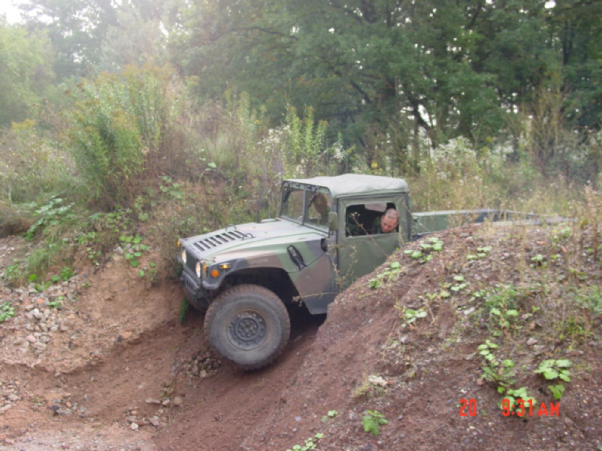 A humvee is driven through steep, off-road terrain during training for the 1st Combat Communicaitons Squadron Airfield Systems shop. (Courtesy Photo)               