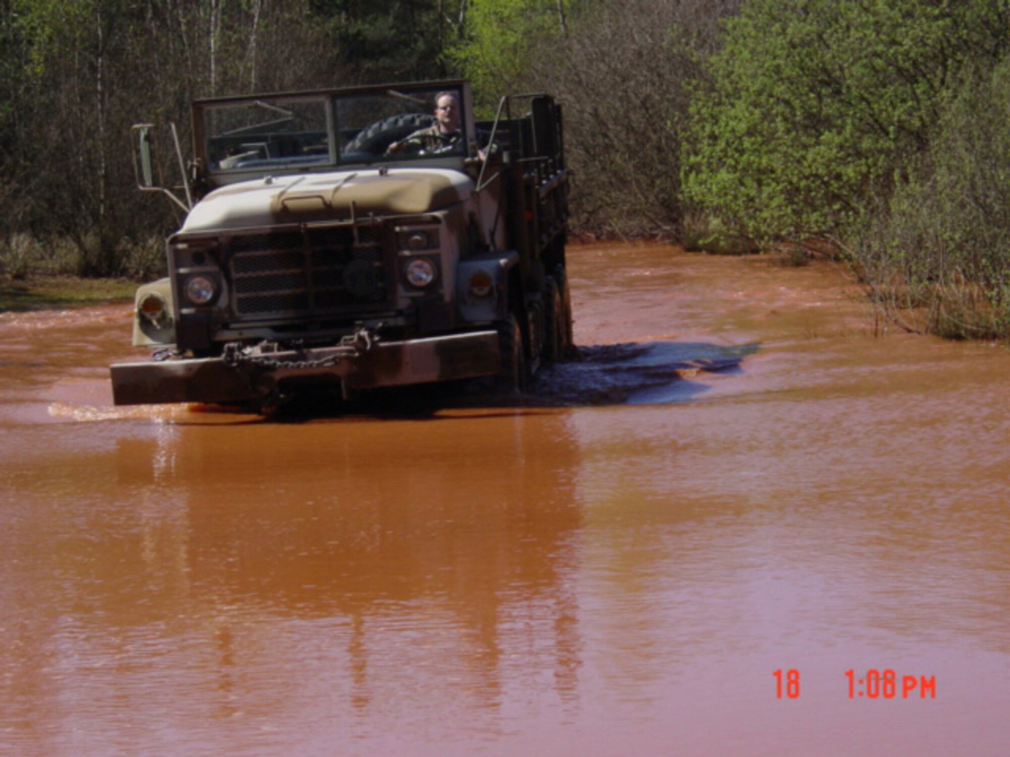 A truck is driven through a pond and uneven terrain during training for the 1st Combat Communicaitons Squadron Airfield Systems shop. (Courtesy Photo)                   