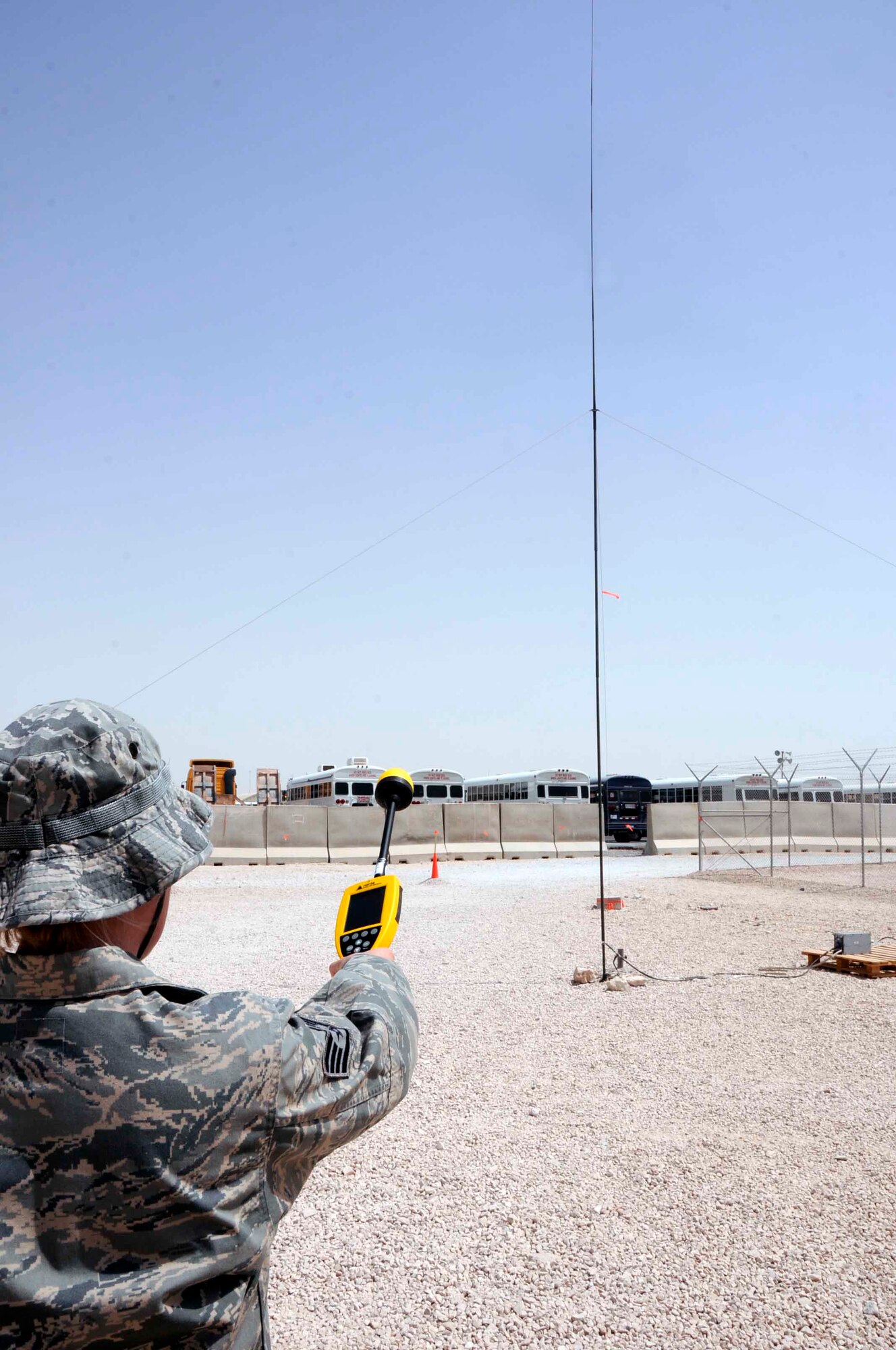 SOUTHWEST ASIA -- Staff Sgt. Ashlie Steele, 379th Expeditionary Medical Group bioenvironmental engineer, uses a Narda probe to perform a radio frequency radiation survey at the VP26 compound here June 26. Sergeant Steele is measuring the RF output of this antenna to ensure it is operating within parameters. (U.S. Air Force photo/ Senior Airman Domonique Simmons)
