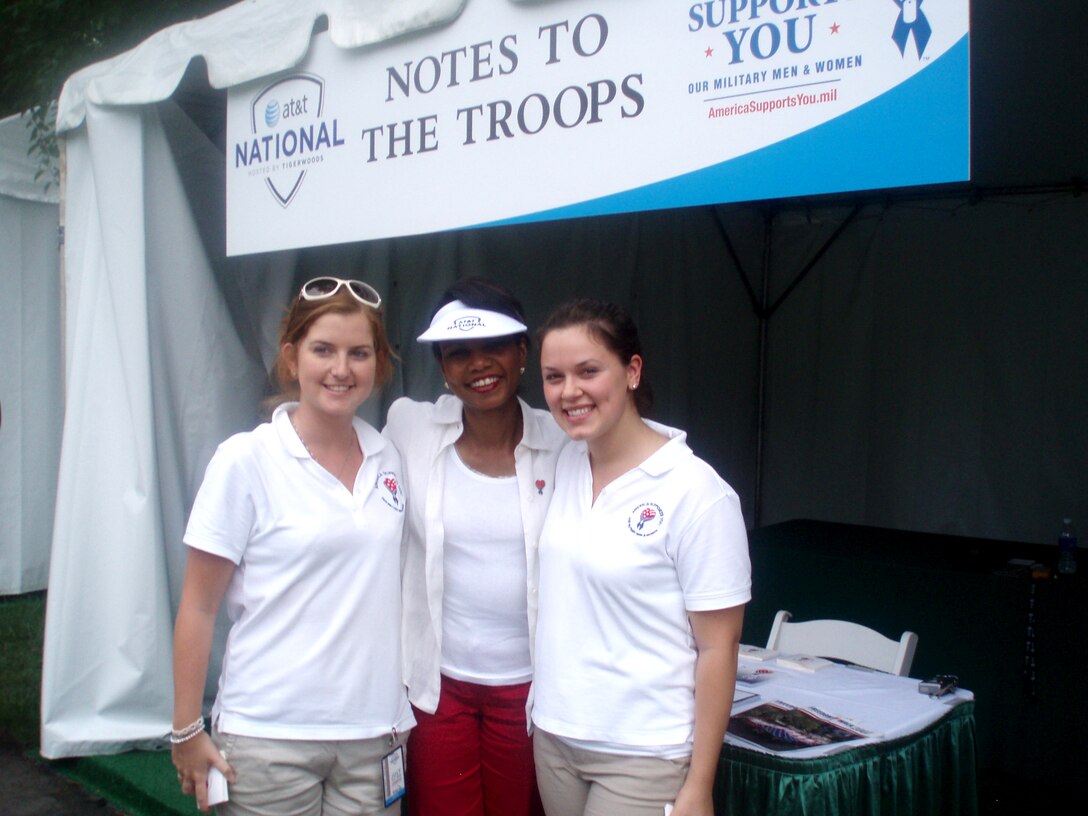 Secretary of State Condoleezza Rice poses for pictures with two members of the "America Supports