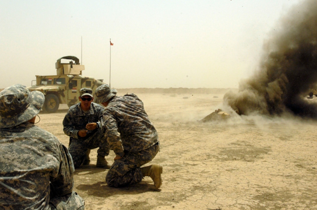 U.S. soldiers set off explosives during an IED reaction training course with Iraqi soldiers on Camp Echo, Iraq, July 2, 2008. The U.S. soldiers are assigned to Operational Detachment Alpha team 0326.
