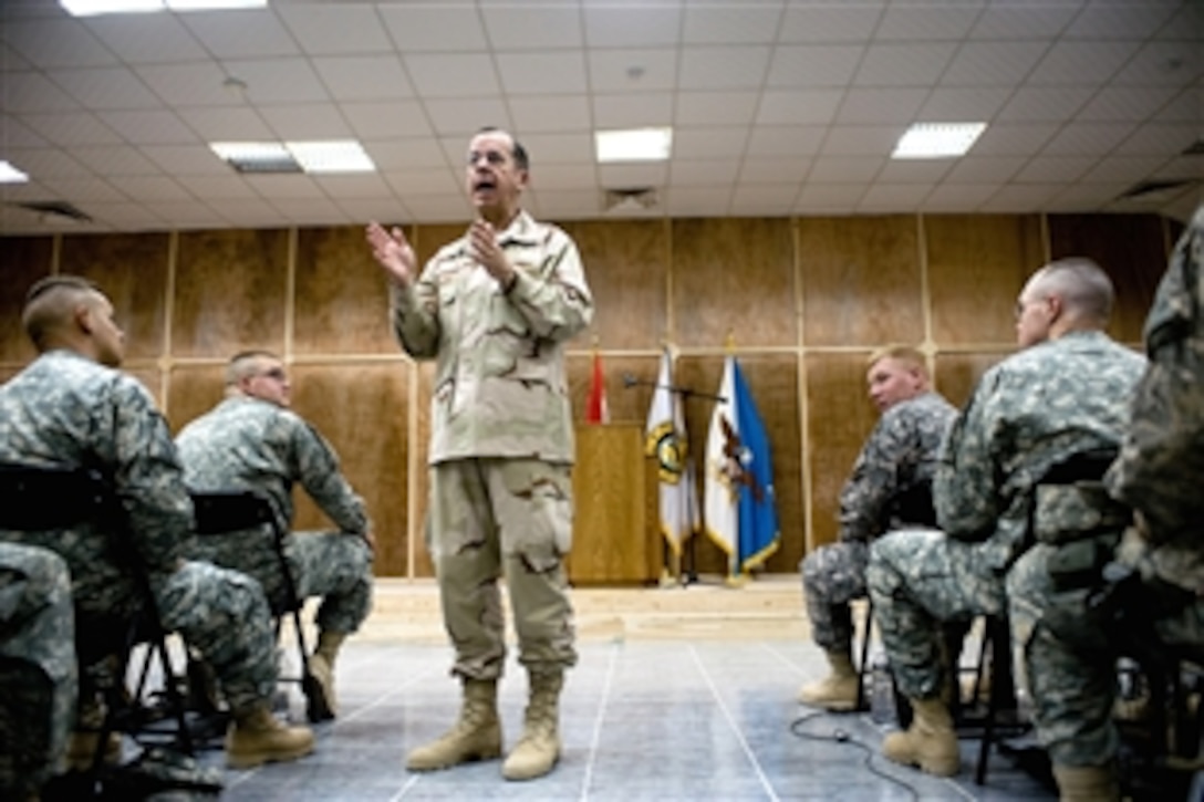 U.S. Navy Adm. Mike Mullen, chairman of the Joint Chiefs of Staff, addresses soldiers assigned to Multinational Division-Baghdad during a town hall-style meeting, Camp Victory, Iraq, July 7, 2008. Mullen is on a six-day tour of the region to visit troops and host a USO contingent including NFL All-Pros Drew Brees and Osi Umenyiora, the Dallas Cowboy cheerleaders and former Marshall University football coach Jack Lengyel. 