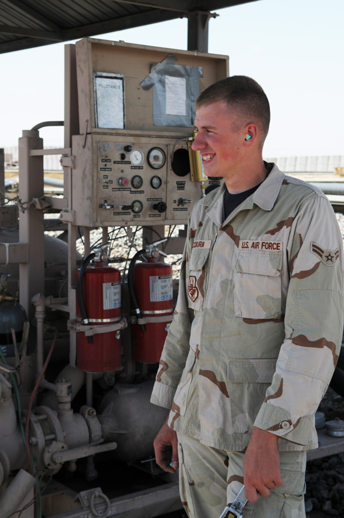 MANAS AIR BASE, Kygryz Republic -- Airman 1st Class Gregory Coburn, a fuels distribution operator with the 376th Expeditionary Logistics Readiness Squadron, refuels a C-17 Globemaster III, July 7, at Manas AB, Kyrgyz Republic. After completing eight refueling runs in a single day, Airman Coburn is fast approaching his one millionth gallon pumped. (U.S. Air Force photo / Airman 1st Class Ruth Holcomb)