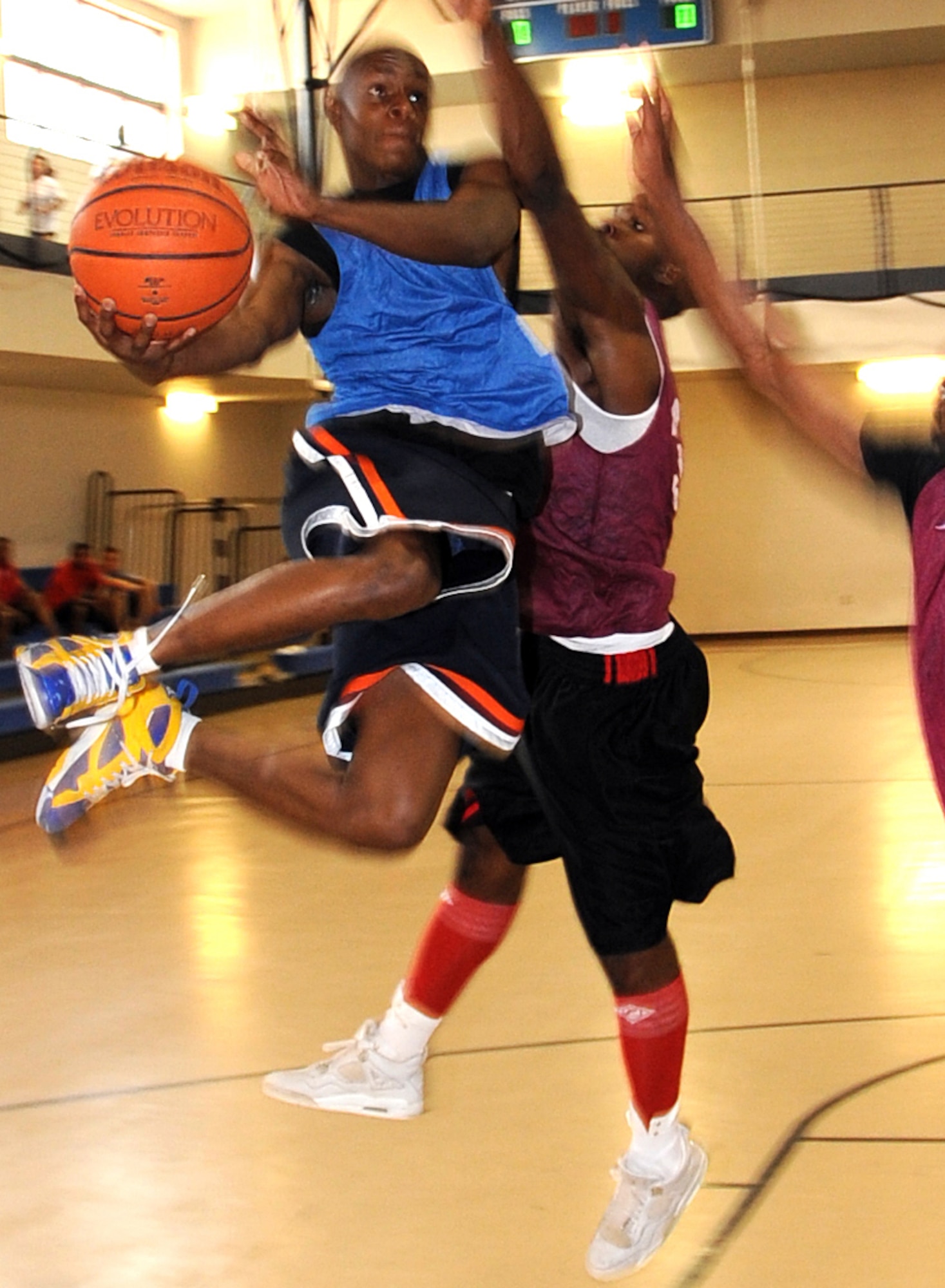 7/03/2008 - Airman 1st Class Jared "Wook" Hudgies, 49 Force Support Squadron, attempts a layup while Airman Andre Powell, 49th Comptroller Squadron, Plays defense during a basketball game in the base fitness center July 3 at Holloman Air Force Base, N.M. The two were competing in a tournament  hosted by the 49th FSS to celebrate the anniversary of America?s independence. (U.S. Air Force photo/Staff Sergeant Chris Flahive)