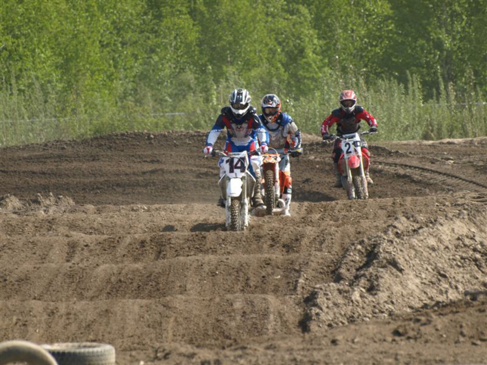 Senior Airman Shawn Martin, 354th Maintenance Squadron aircraft structural maintainer, races against fellow motocross enthusiasts June 8 in North Pole. Airman Martin finished second place in the 125 cubic inch class. (U.S. Air Force photo by Lara Poirrier)      