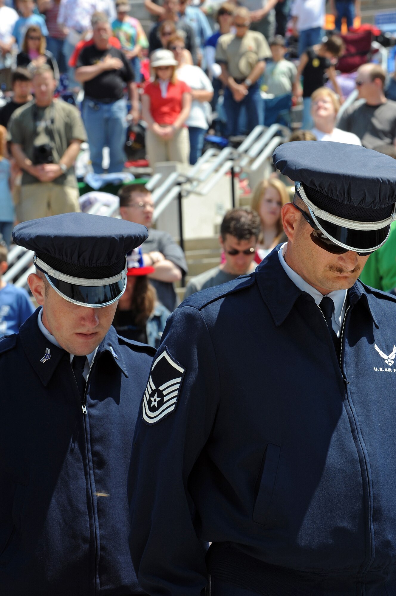 (Left) Airman 1st Class Timothy Johnson and Master Sgt. Bernard Crump, Ellsworth Air Force Base Honor Guard members, pay their respects to fallen service members at Mount Rushmore National Memorial, July 3. Approximately 30,000 people came to the memorial for the 2008 Independence Day Celebration. (U.S. Air Force photo/Senior Airman Marc I. Lane)
