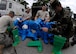 Members of the 375th Civil Engineer Squadron emergency response team suit up for a simulated response to a suspicious package on June 3, 2008 at 15:52 Zulu on Scott Air Force Base, Ill.  The Readiness and Emergency Response flight perform weekly exercises to ensure proficiency. (U.S. Air Force photo by Senior Airman Mildred Guevara) (RELEASED)