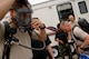 Senior Airman Casey Garwood, 375th Airlift Wing Civil Engineer Squadron emergency manager, puts on a breathing apparatus during a training exercise June 4, 2008 at 15:40 Zulu on Scott Air Force Base, Ill.  The Readiness and Emergency Response flight performs weekly exercises to ensure proficiency.  (U.S. Air Force photo by Airman 1st Class Megan Gilliland) (RELEASED)