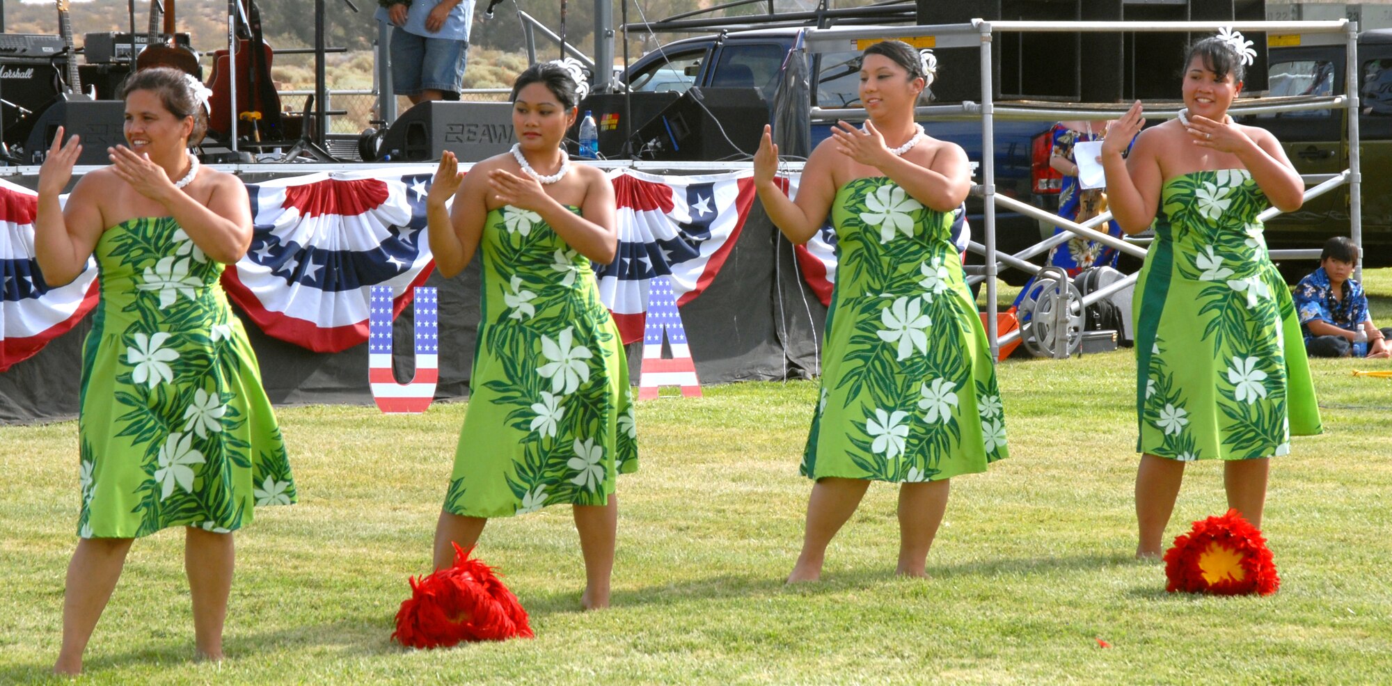 Volunteers perform a Hawaiian dance during the bases' 12th Annual Summer Bash celebration at Robert and Wings Field July 4. The festivity is in celebration of the United States' 232nd birthday. (Air Force photo by Airman 1st Class William O'Brien) 