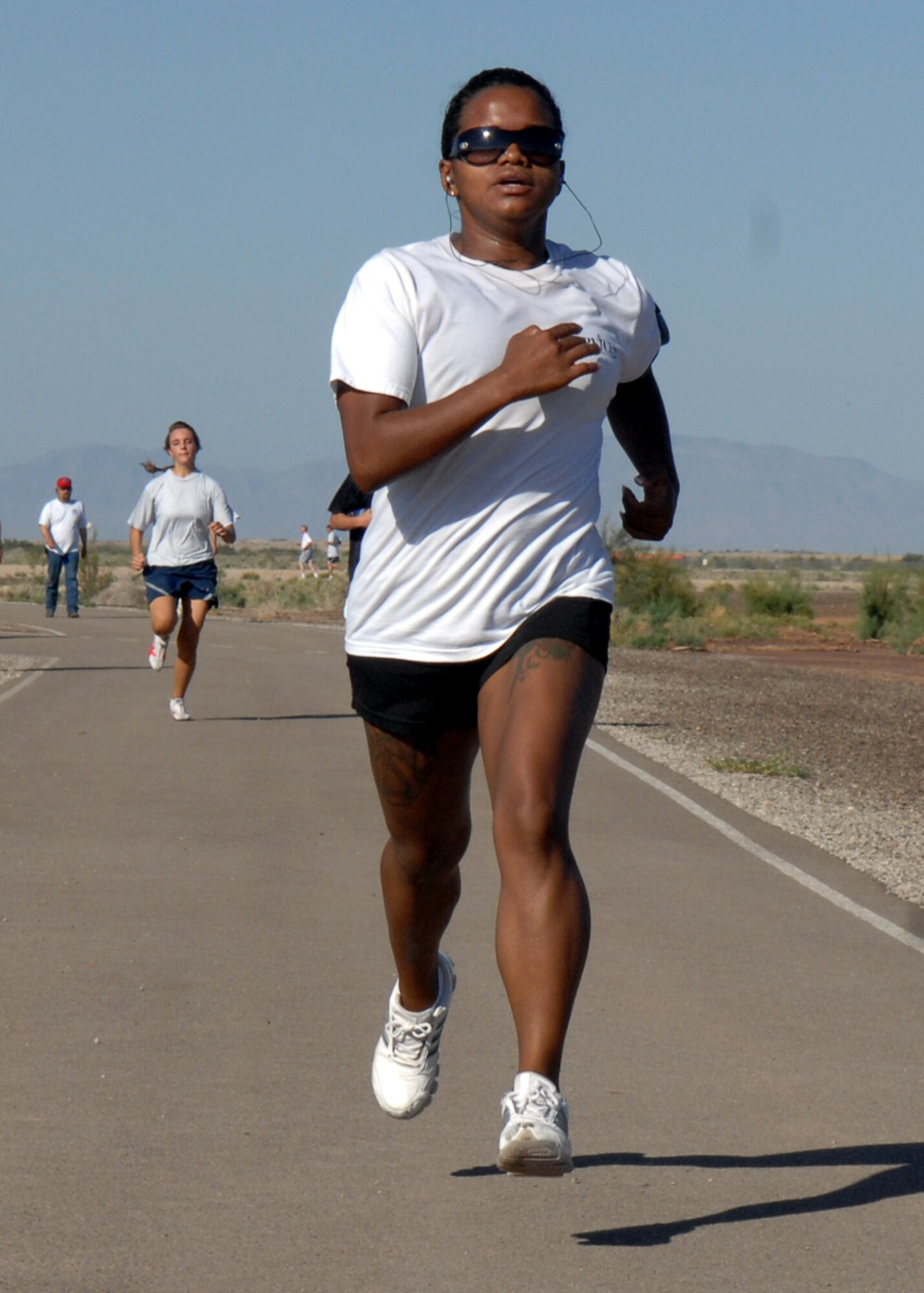 Airman 1st Class Ana Jackson, 49th Maintenance Squadron, maintains a steady pace and form during the four mile Freedom Fest Fun Run, hosted by the 49th
Force Support Squadron July 3 at Holloman Air Force Base, N.M. Airman Jackson finished 2nd overall in the female cateorgory. Holloman hosted the Freedom Fest Fun Run and other events as a way of celebrating Independence Day.
 
(U.S. Air Force photo/Senior Airman Anthony Nelson Jr)
