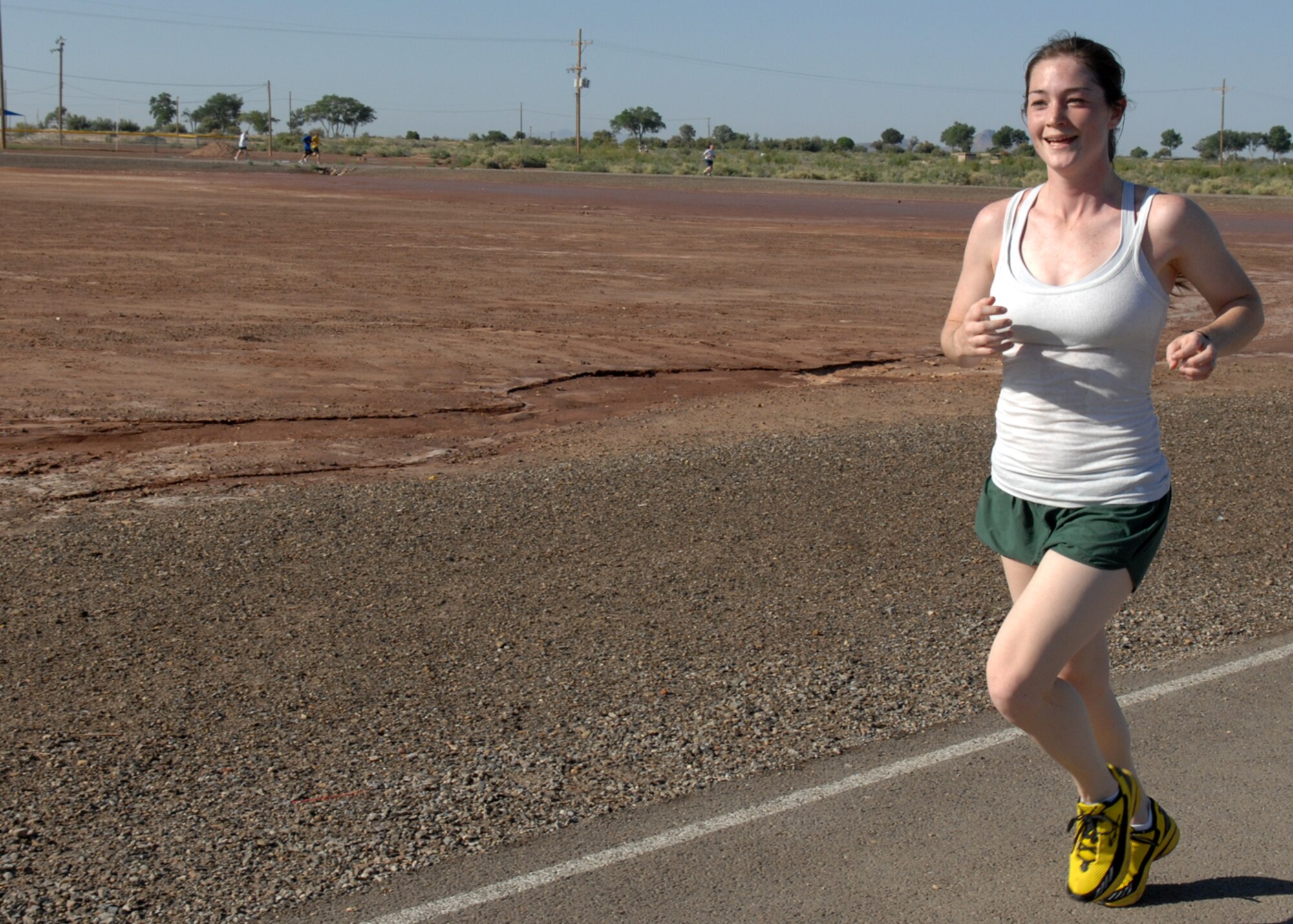 2nd Lt. Anastasia Kovarik, 49th Civil Engineer Squadron, smiles as she prepares to cross the finish line during the four mile Freedom Fest Fun Run, hosted by the 49th Force Support Squadron  July 3 at Holloman Air Force Base, N.M. 2nd Lt Kovarik finished 1st overall in the female category with a time of 31:36. Holloman hosted the Freedom Fest Fun Run and other events as a way of celebrating Independence Day.

(U.S. Air Force photo/Senior Airman Anthony Nelson Jr)
