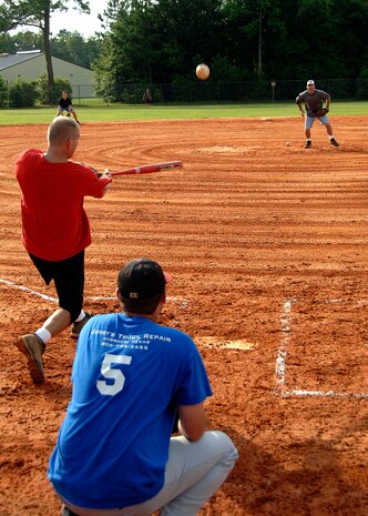 Rodney Rutz hits a line drive to center field during a game at the base softball field July 7. The Flyers beat the Medical Group by forfeiture during intramural softball playoffs which began this week. Rutz is with the 16th Airlift Squadron and plays for the Flyers. (U.S. Air Force photo/Airman 1st Class Timothy Taylor)