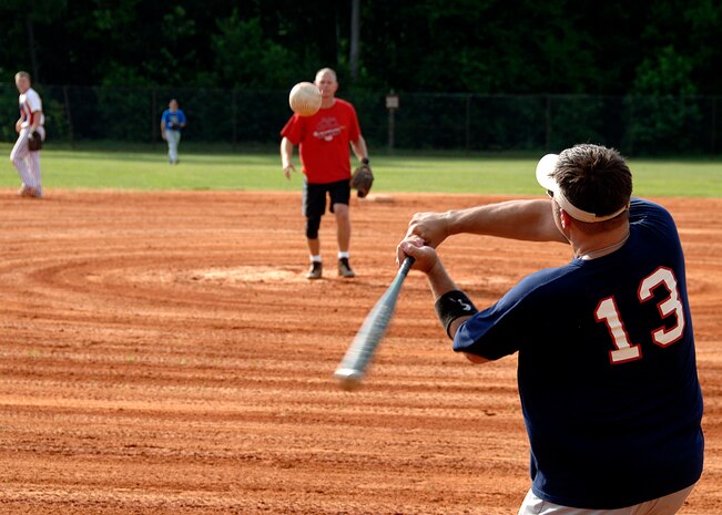 Christopher Anthony gets a base hit for the Flyers during the first inning at the base softball field July 7. The Flyers beat the Medical Group by forfeiture during intramural softball playoffs which began this week. Anthony is with the 15th Airlift Squadron. (U.S. Air Force photo/Airman 1st Class Timothy Taylor)