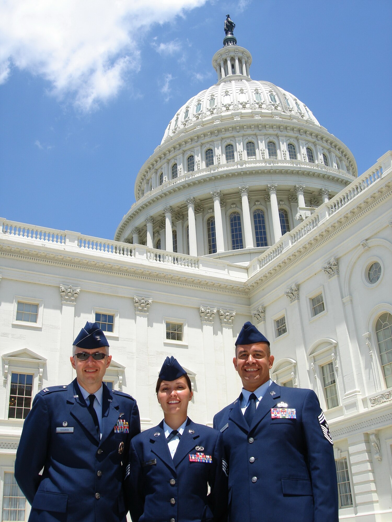 Staff Sgt. Stephanie Secor, 41st Helicopter Maintenance Unit electrical and environmental journeyman, stands in between Col. Kenneth Todorov, 23rd Wing Commander, and Chief Master Sgt. Paul Burgess, 23rd Wing Command Chief, in front of Capitol Hill recently. She accompanied the senior leaders as part of the Capitol Hill Visit Program. (Courtesy photo)