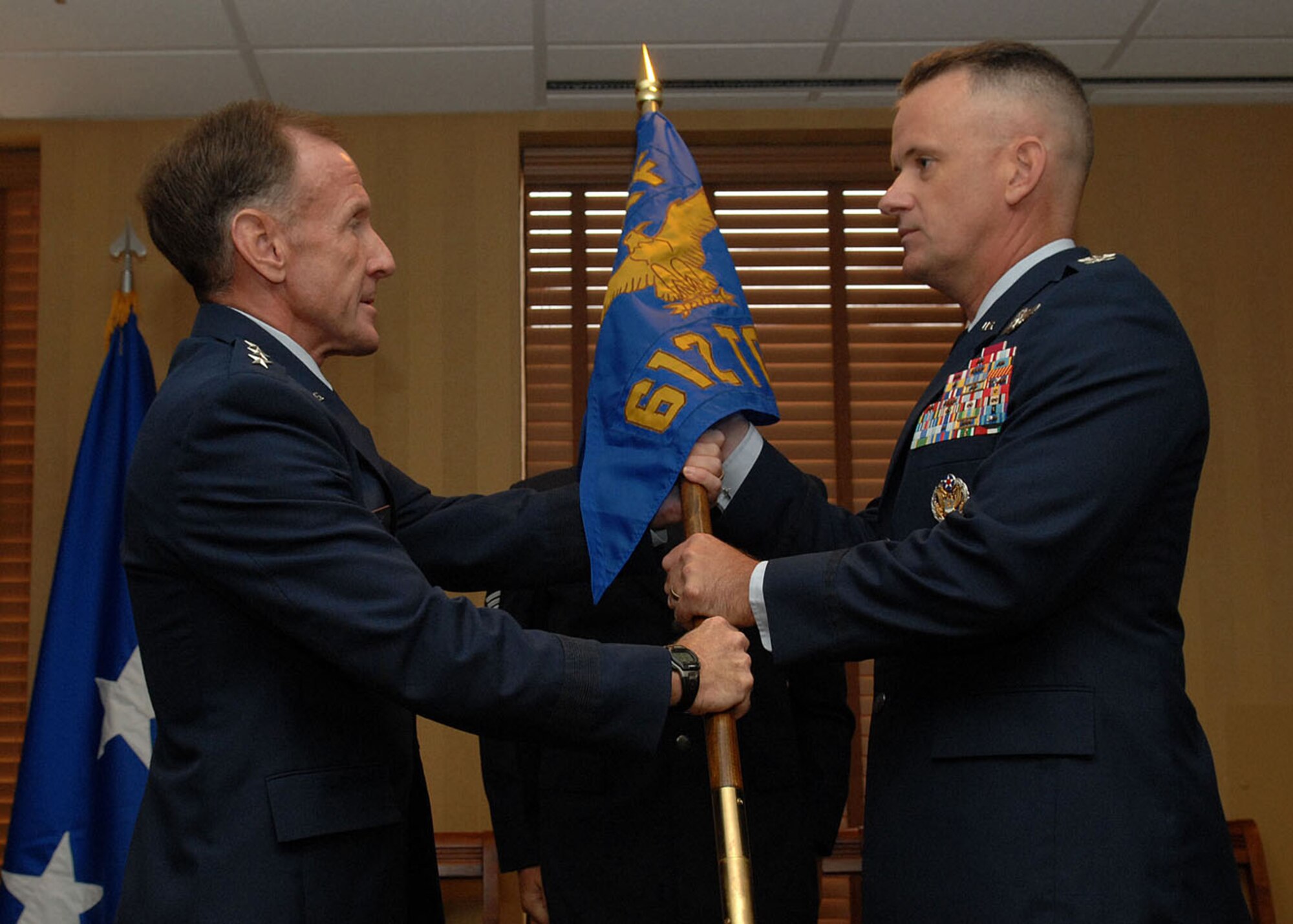 Col. Douglas Galipeau (right) receives the 612th Theater Operations Group guidon from the Lt.Gen. Norman Seip, 12th Air Force (Air Forces Southern) commander during a change-of-command ceremony here June 27. Colonel Galipeau assumed command of the 612th TOG after serving as the Deputy Director Sectary of the Air Force Personnel Council, Andrews Air Force Base, MD.  (U.S. Air Force Base photo by Senior Airman Jacqueline Hawkins)