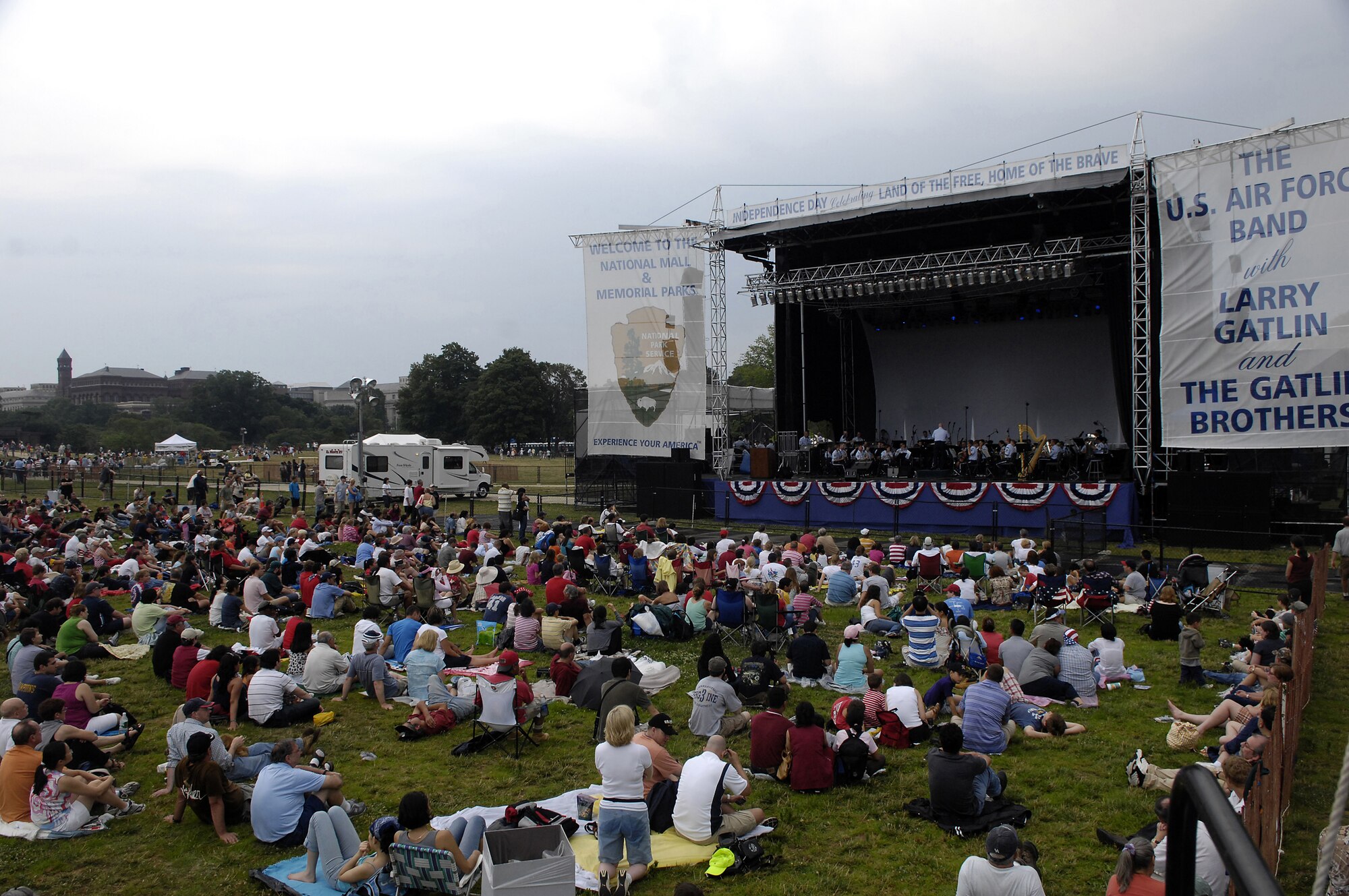 A crowd gathers before the U.S. Air Force Band's performance July 4 at the Washington Monument. The Band presents a special concert open to the public at the base of the Washington Monument as part of the National Park Service's Independence Day Celebration. The program included the Concert Band, the Singing Sergeants, Max Impact and a special appearance by the Grammy Award-winning country artists Larry Gatlin and the Gatlin Brothers. (U.S. Air Force photo by Senior Airman Marleah Miller)