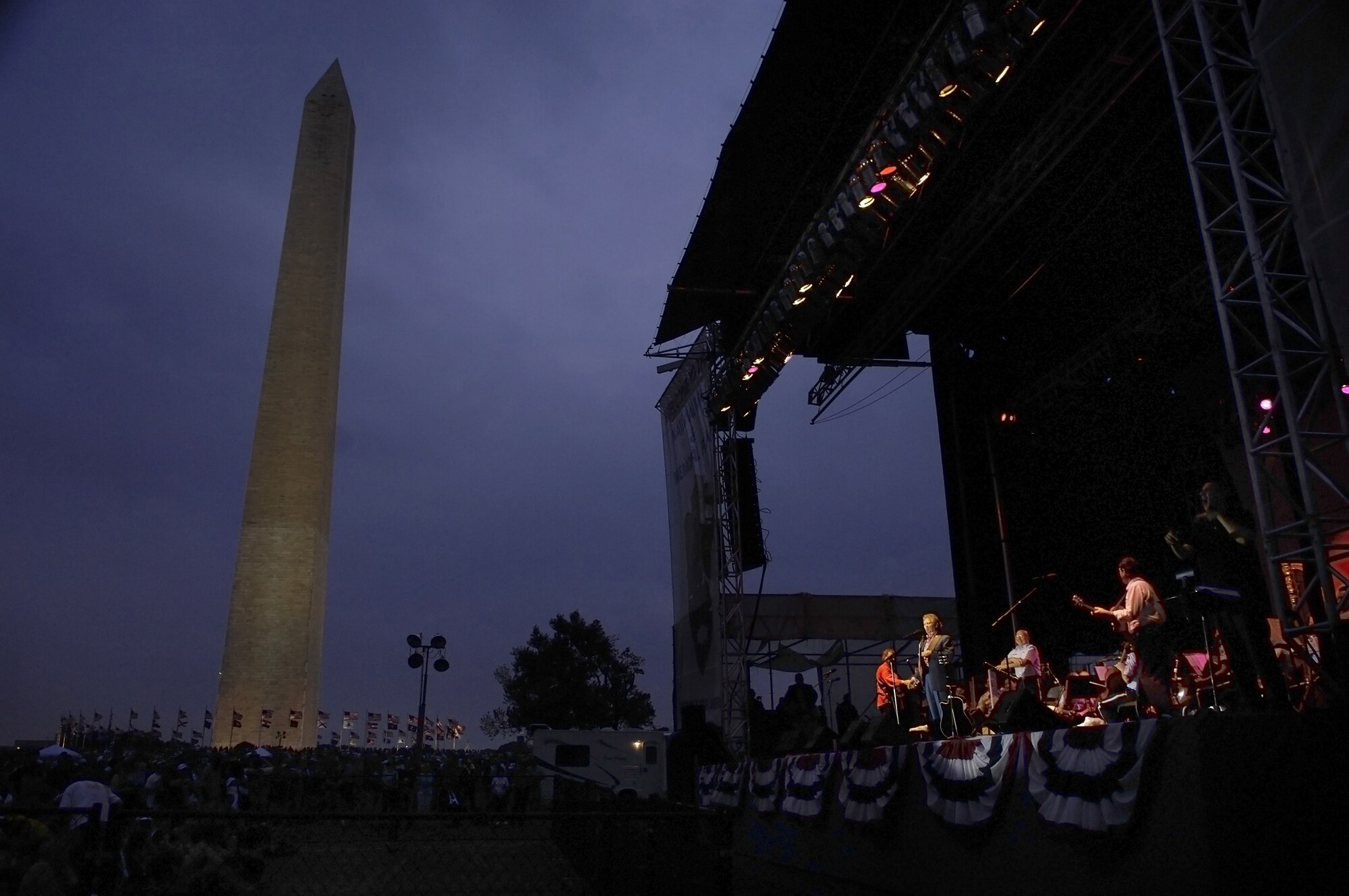 Larry Gatlin and the Gatlin Brothers perform on stage with the U.S. Air Force Band July 4 at the Washington Monument. The Band presents a special concert open to the public at the base of the Washington Monument as part of the National Park Service's Independence Day Celebration. The program included the Concert Band, the Singing Sergeants, Max Impact and a special appearance by the Grammy Award-winning country artists Larry Gatlin and the Gatlin Brothers. (U.S. Air Force photo by Senior Airman Marleah Miller)