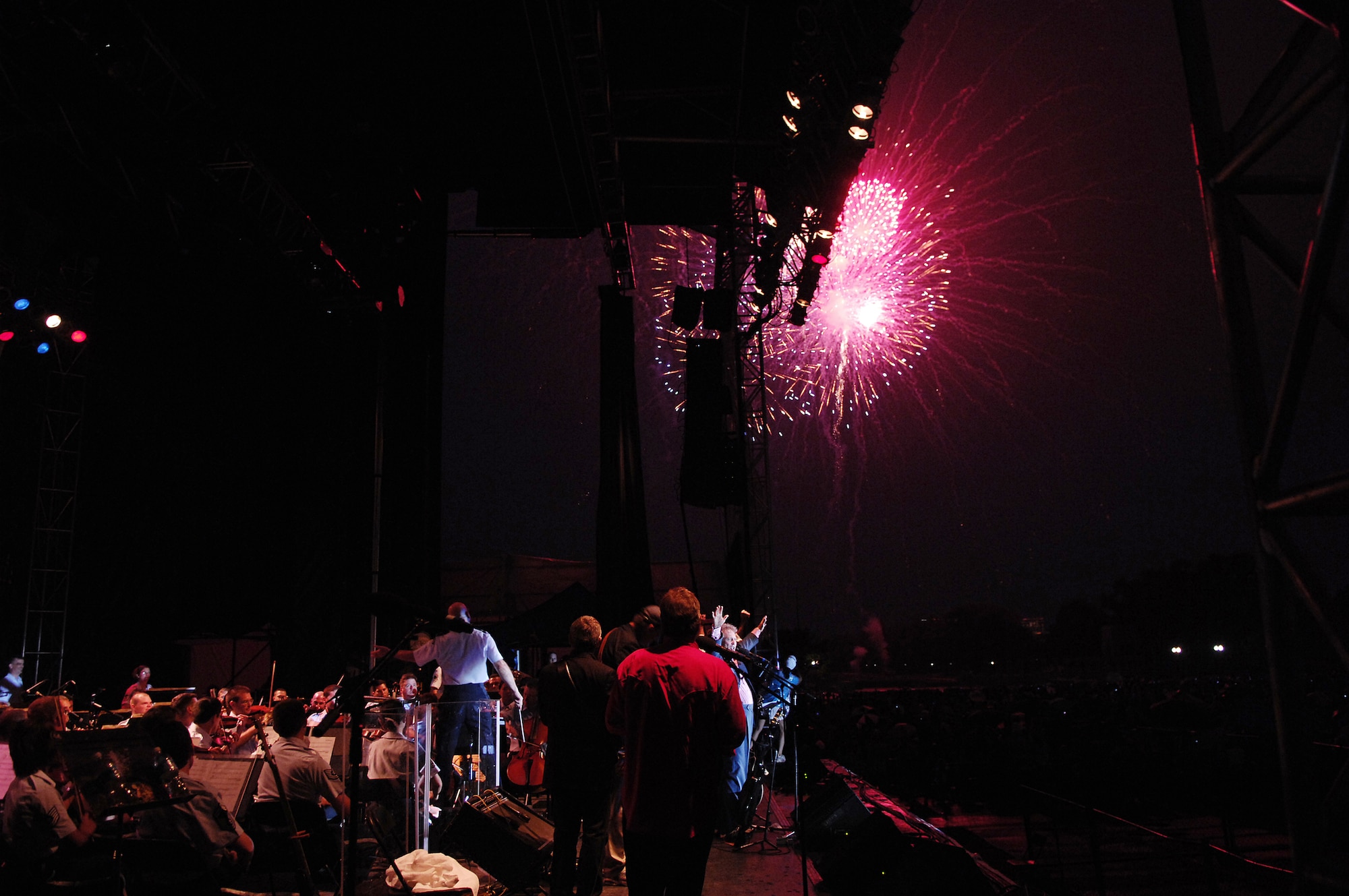 Larry Gatlin and the Gatlin Brothers along with the U.S. Air Force Band watch fireworks over the nation's capital July 4 after a concert at the Washington Monument. The Band presents a special concert open to the public at the base of the Washington Monument as part of the National Park Service's Independence Day Celebration. The program included the Concert Band, the Singing Sergeants, Max Impact and a special appearance by the Grammy Award-winning country artists Larry Gatlin and the Gatlin Brothers. (U.S. Air Force photo by Senior Airman Marleah Miller)