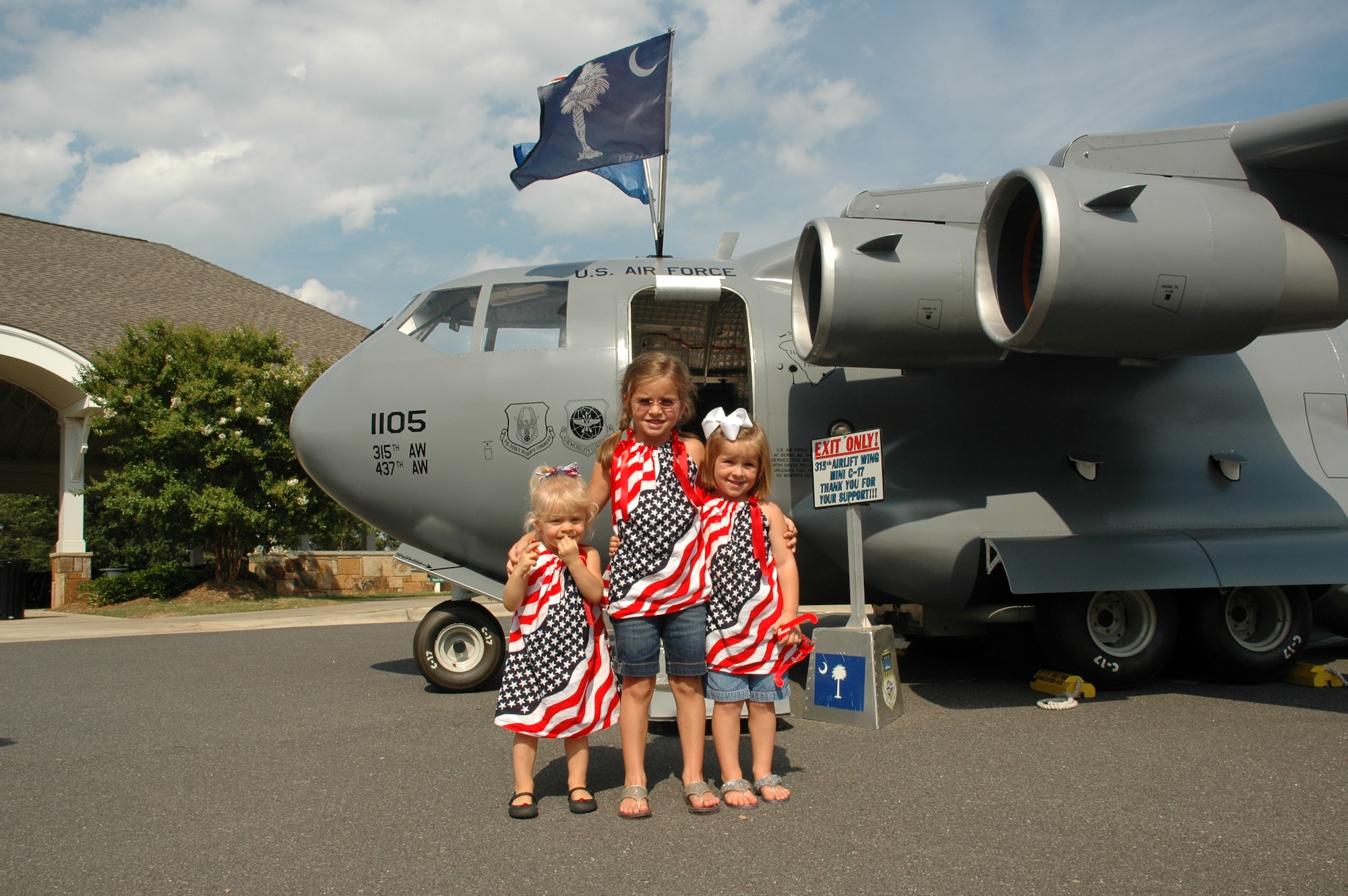 Showing their patriotic spirit, children from Tega Cay, S.C., take time to enjoy the Mini C-17 during the city’s 26th anniversary celebration July 4 at the new Philip Glennon Community Center. (photo by 2nd Lt. Holly Carlisle, USAFR)