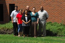 MINOT AIR FORCE BASE, N.D. -- University and education center advisors from the Francis X. Deignan Center pose for a group photo June 27 here. The Francis X. Deignan Center is the base education center and library located between Outoor Recreation and the Northern Lights Chapel on Missile Avenue. (U.S. Air Force photo by Airman 1st Class Benjamin Stratton)
