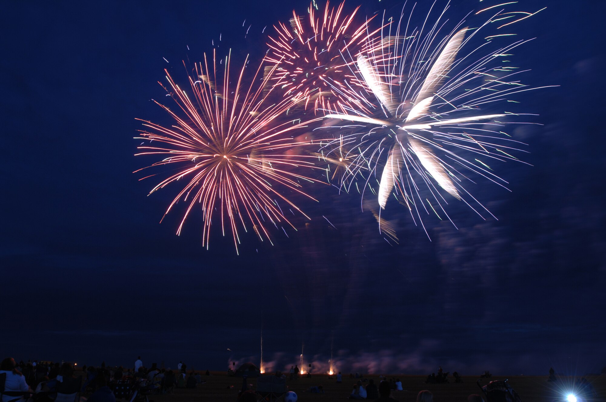 To celebrate America's Independence Day, military members and their families from RAFs Feltwell, Lakenheath and Mildenhall, as well as local British citizens, enjoy a traditional fireworks demonstration held at RAF Feltwell, England July 4, 2008. (U.S. Air Force photo by Master Sgt. Tracy L. DeMarco)