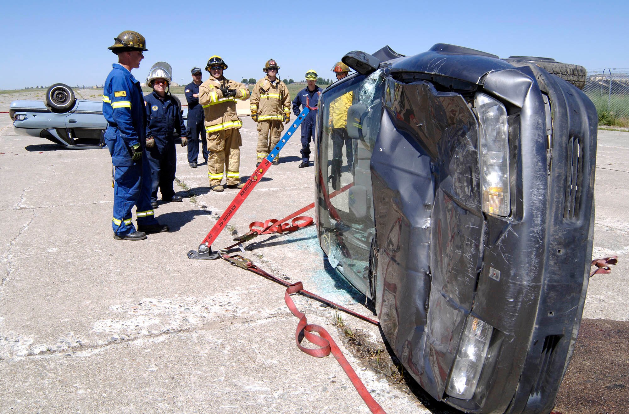 FAIRCHILD AIR FORCE BASE, Wash. – A firefighters team prepares to use the Tension Buttress System at the Extrication Spokane 2008. The system is used to help stabilize the rails in the car from collapsing. The integrated teams of various firemen learned advanced auto extrication techniques. The training consisted of two ten-hour days with eight different objectives. (U.S. Air Force photo/Staff Sgt. JT May III)