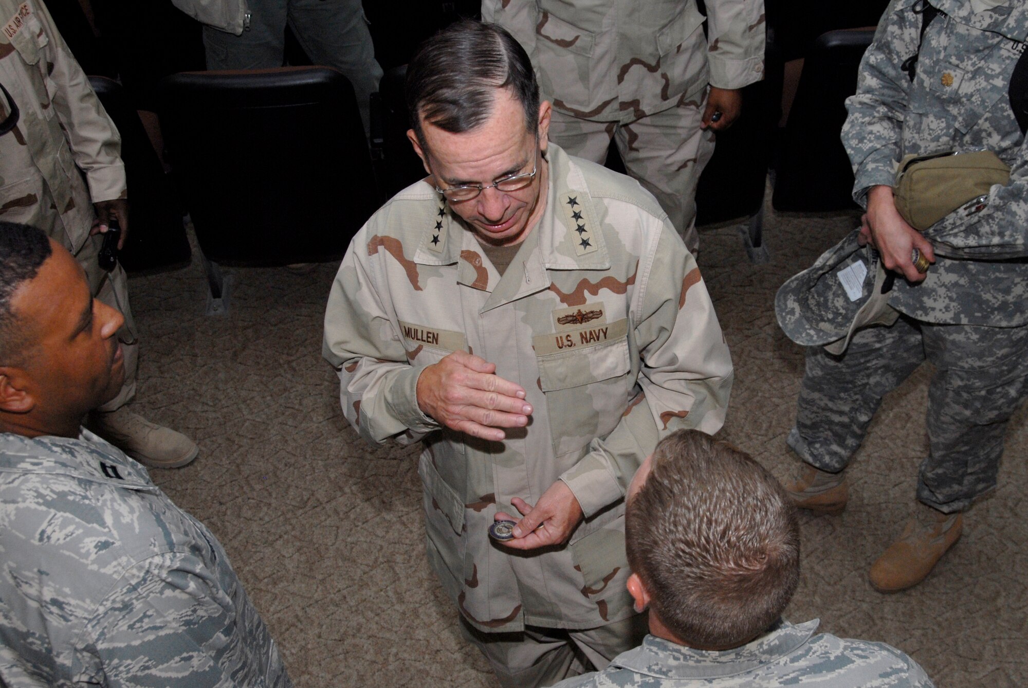 SOUTHWEST ASIA -- Navy Admiral Mike Mullen, chairman of the Joint Chiefs of Staff, speaks with Airmen from the 386th Air Expeditionary Wing July 7, 2008, at the theatre on an air base in the Persian Gulf Region. Admiral Mullen is on a seven-day, summer troop visit and United Service Organizations tour. (U.S. Air Force photo/Staff Sgt. Patrick Dixon)