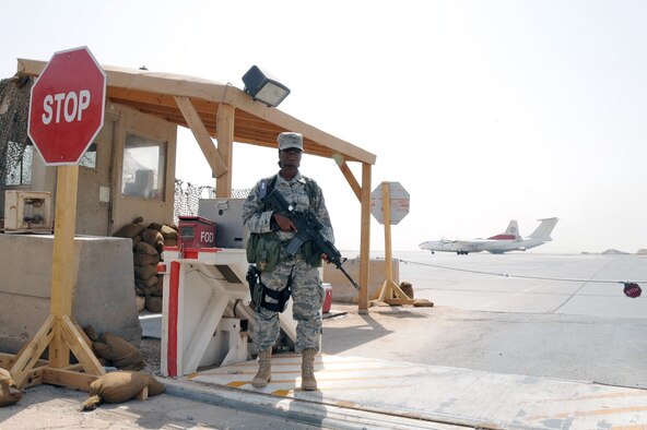 ALI BASE, Iraq -- Senior Airman Nikita Govan, security forces sentry response force Airman, safeguards the entry and exit onto the flightline July 8. The Airman provides security for Air Force, Army, Navy and coalition aircraft on the airfield here. Airman Govan is deployed to the 407th Expeditionary Security Forces Squadron from Moody Air Force Base, Ga. (U.S. Air Force photo/Tech. Sgt. Sabrina Johnson) 
