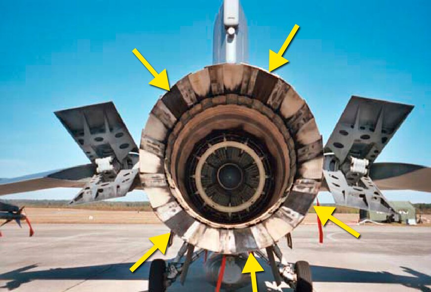 An F-16 Fighting Falcon F100 engine exhaust nozzle with five A500 Ceramic Matrix Composite divergent seals, identified by the yellow arrows. Air Force Research Laboratory and industry are partnering to test the ceramic materials as candidates to replace nickel-based superalloys currently used in exhaust nozzles. (U.S. Air Force photo)