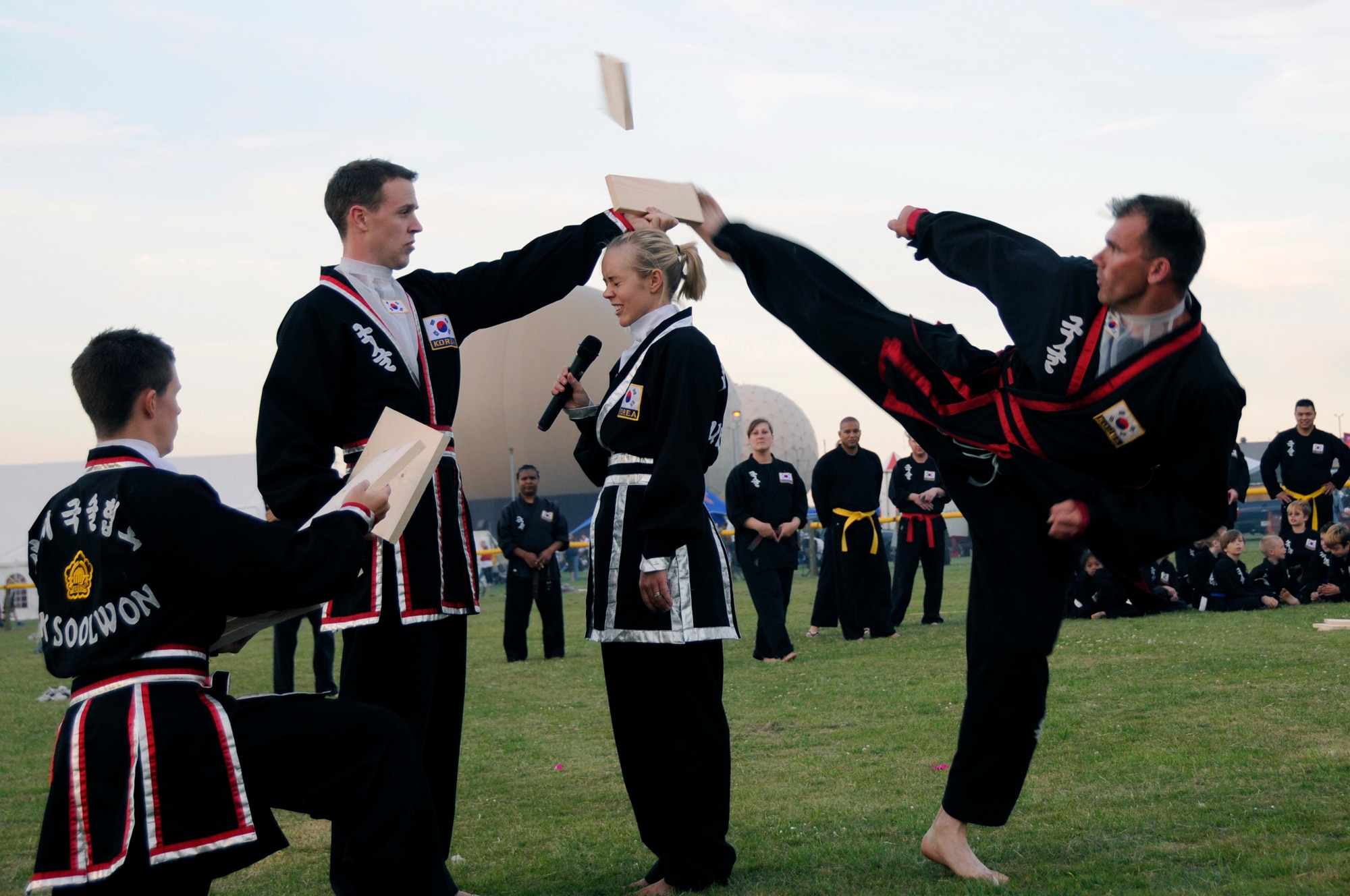 Kuk Sool Won members demonstrate wood breaking during the Fourth of July celebration at RAF Feltwell. The members demonstrated many different fighting styles and self defense techniques. (U.S. Air Force photo by Airman Perry Aston)
