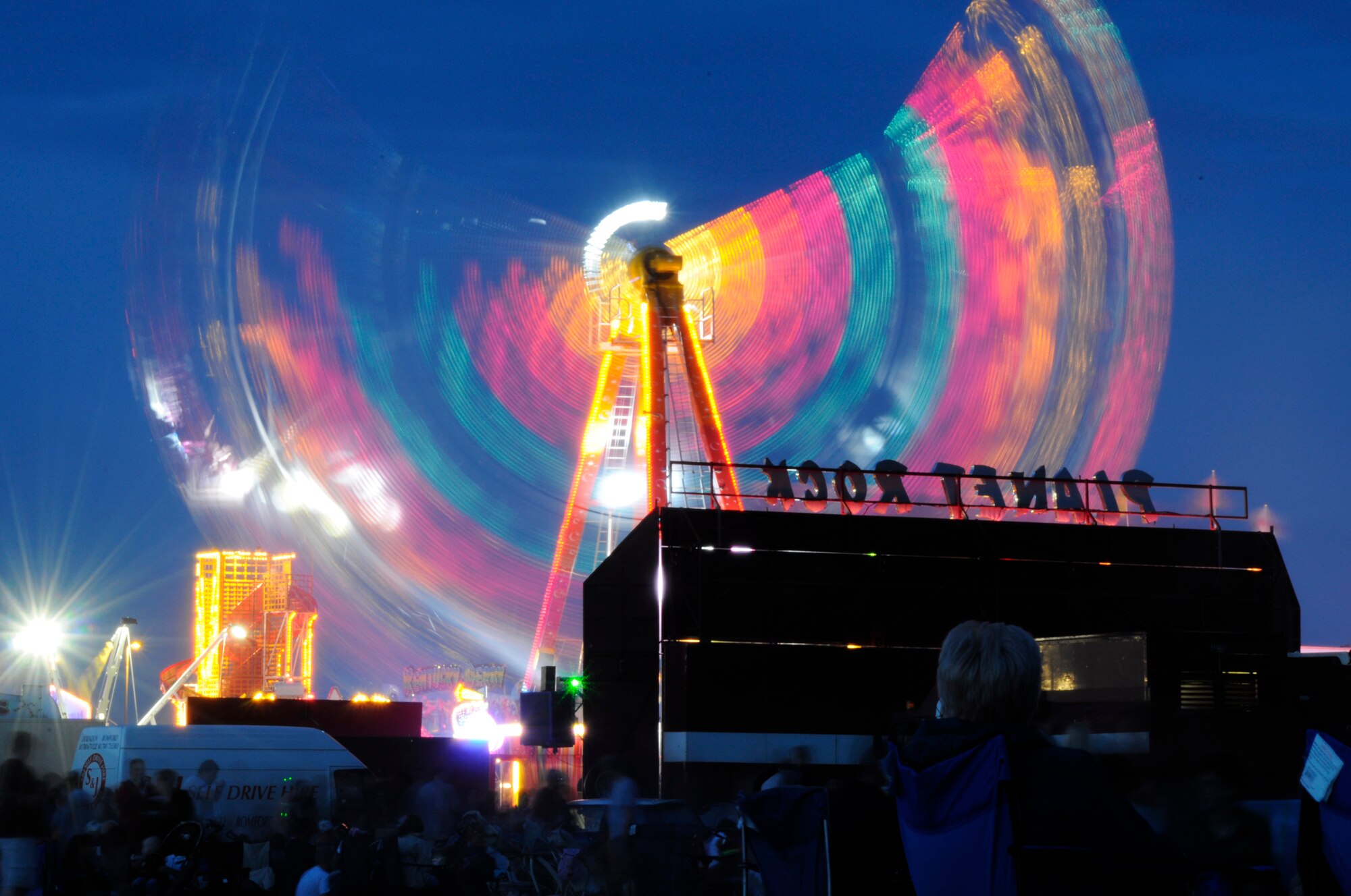 One of many rides available to American and British patron’s lights up as the sun set on RAF Feltwell. The base was open to all military families and British locals for the Fourth of July celebration. (U.S. Air Force photo by Airman Perry Aston)