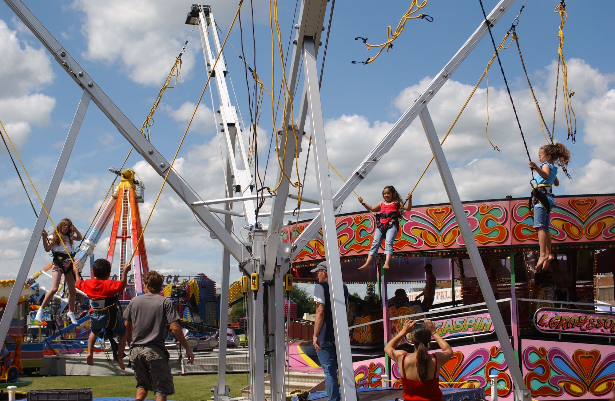 Young Fourth of July patrons enjoy a ride at the celebration. There were rides for youths and adults alike. (U.S. Air Force photo by Airman 1st Class Kristopher Levasseur)