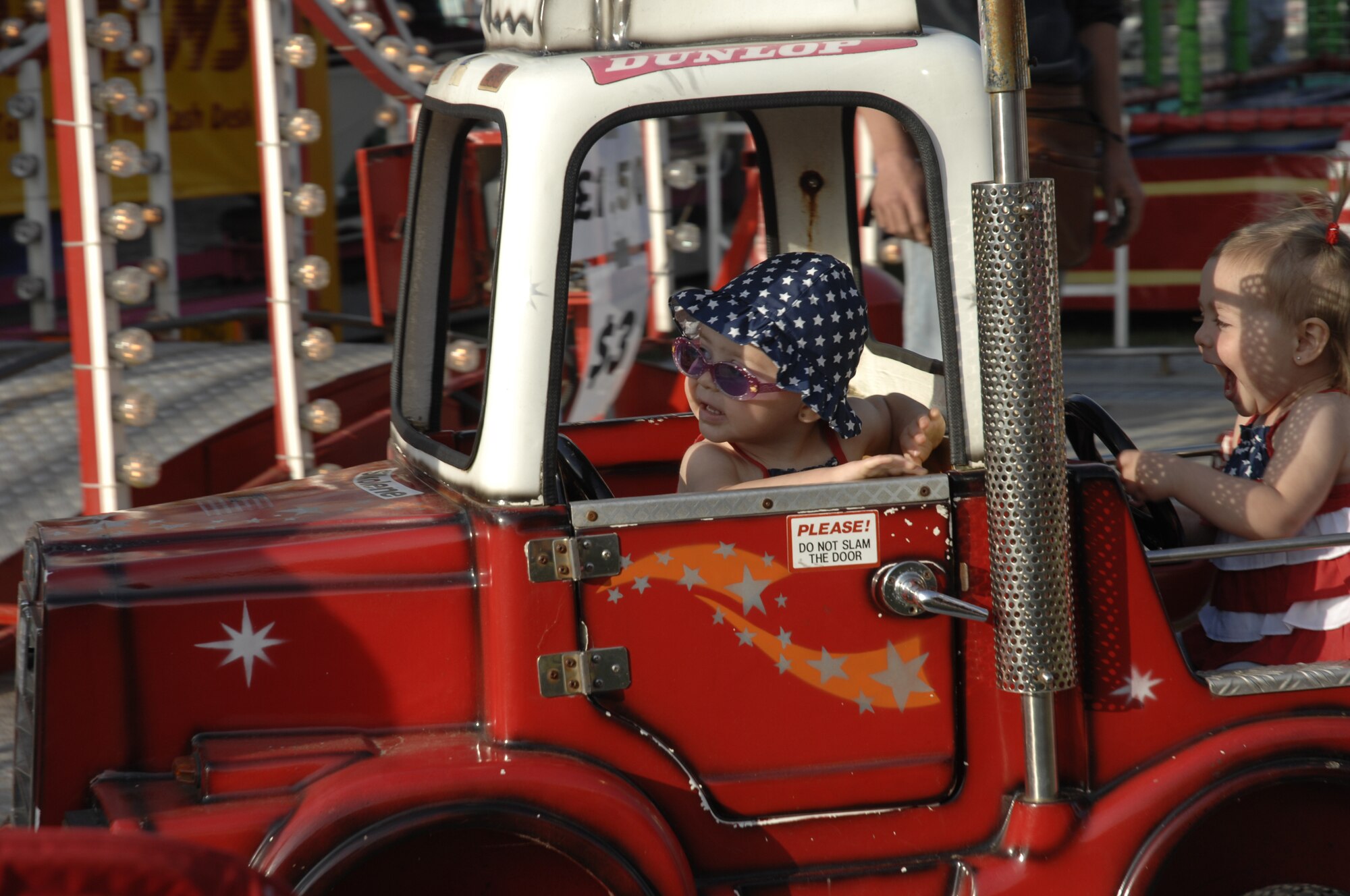 Young Fourth of July enthusiasts enjoy a ride at the celebration. There were rides for youths and adults alike. (U.S. Air Force photo by Tech. Sgt. J. LaVoie)