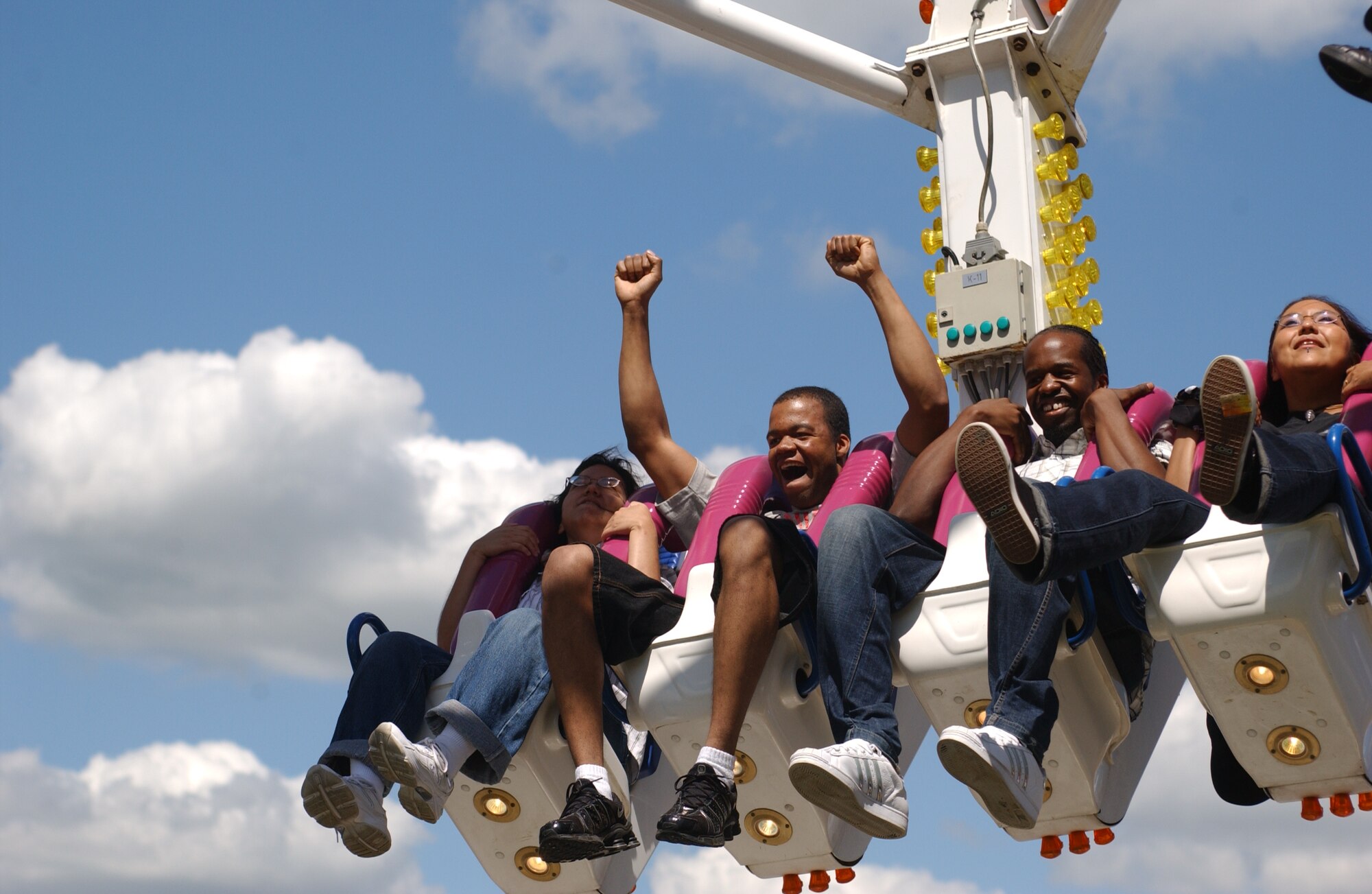 Military families and British locals enjoy one of the many rides available at the Fourth of July celebration on RAF Feltwell. (U.S. Air Force photo by Airman 1st Class Kristopher Levasseur)