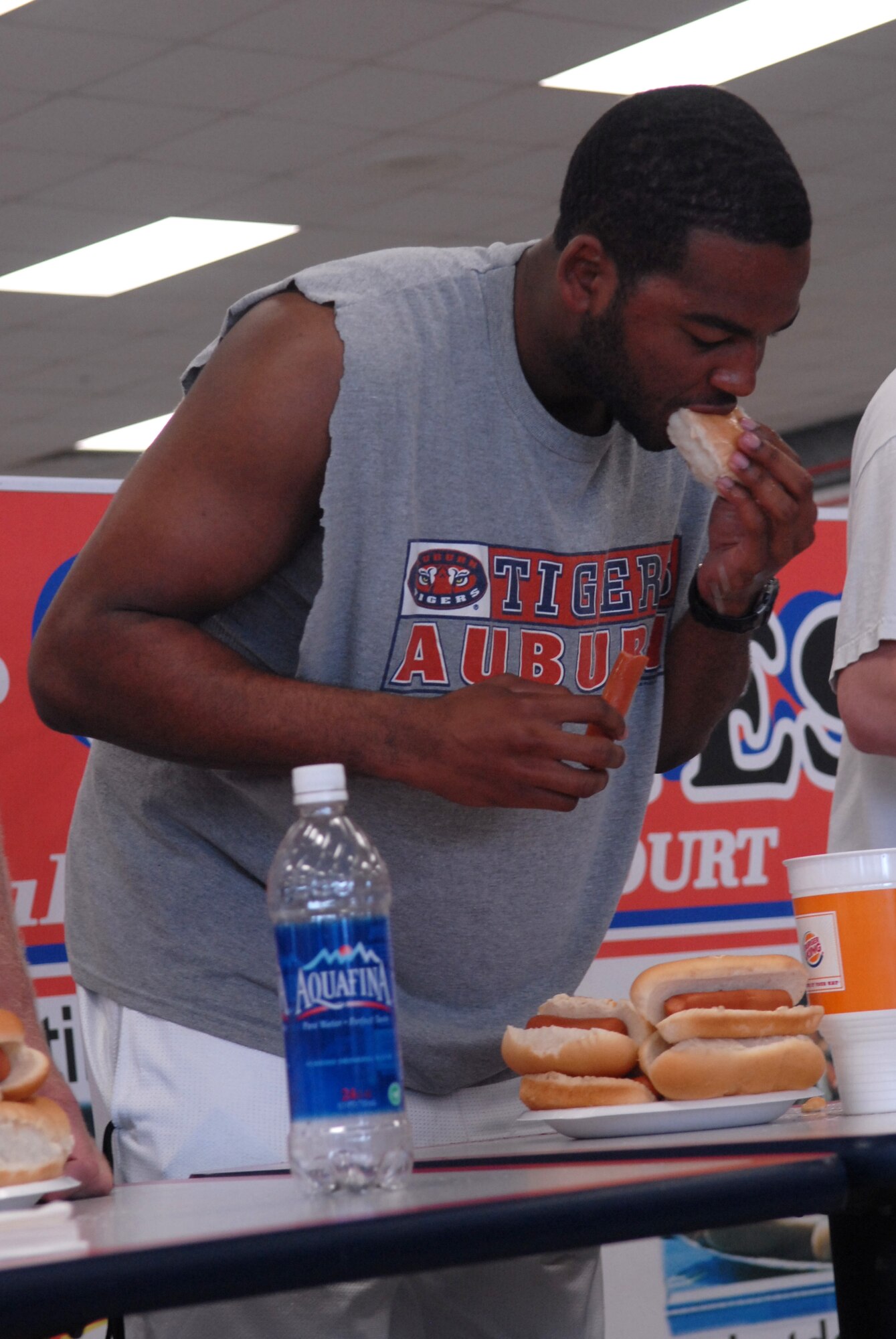 KUNSAN AIR BASE, Republic of Korea— Senior Airman Darryl Hill, 8th Security Forces Squadron, scarfs down a hot dog during the competitive eating contest here July 4. The contest was just one of the many actives held here to celebrate Independence Day.( US Air Force Photo by: Senior Airman Angela Ruiz)