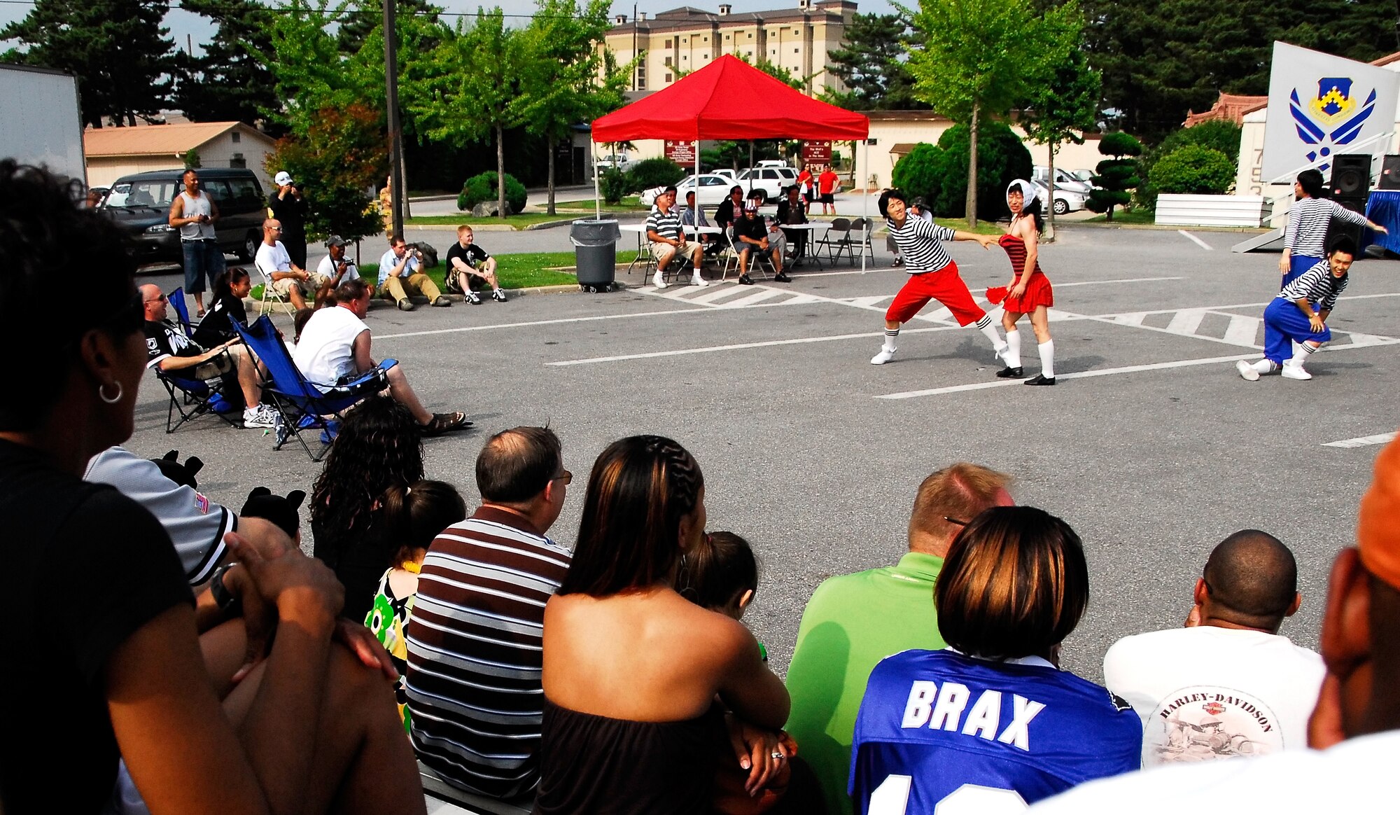 KUNSAN AIR BASE, Republic of Korea -- Members of the Korean Cultural Dance group perform for Wolf Pack members during a Fourth of July celebration here July 4.  Kunsan Air Base held several different for their Airmen in celebration of Independence Day.  (U.S. Air Force photo/Tech. Sgt. Quinton T. Burris)