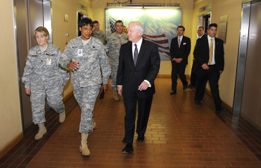 Defense Secretary Robert M. Gates walks with Brig. Gen. Sheila Baxter, middle, commanding general of Madigan Army Medical Center, and Lt. Col. Lena Gaudreau, while on a tour of Fort Lewis, Wash., July 7, 2008.  