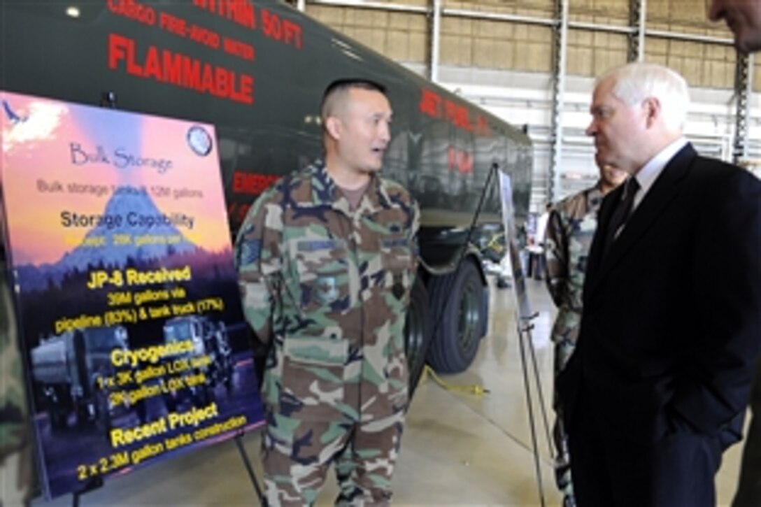 U.S. Defense Secretary Robert M. Gates receives a briefing from an Air Force airman while touring the facilities on McChord Air Force Base, Wash., July 7, 2008. Gates visited McChord and the U.S. Army's Fort Lewis, Wash. 