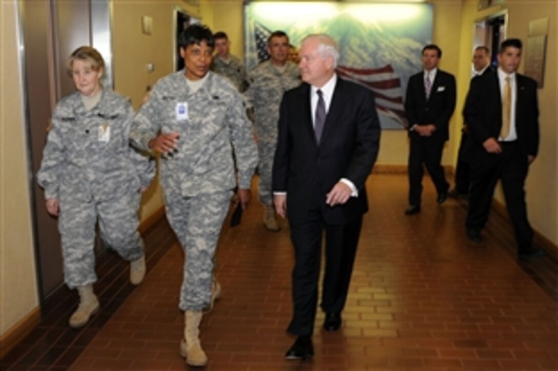 U.S. Defense Secretary Robert M. Gates walks with U.S. Army Brig. Gen. Sheila Baxter, commanding general of Madigan Army Medical Center, while on a tour of the facilities at Fort Lewis, Wash.,  July 7, 2008. Lt. Col. Lena Gaudreau walks on the far left.
