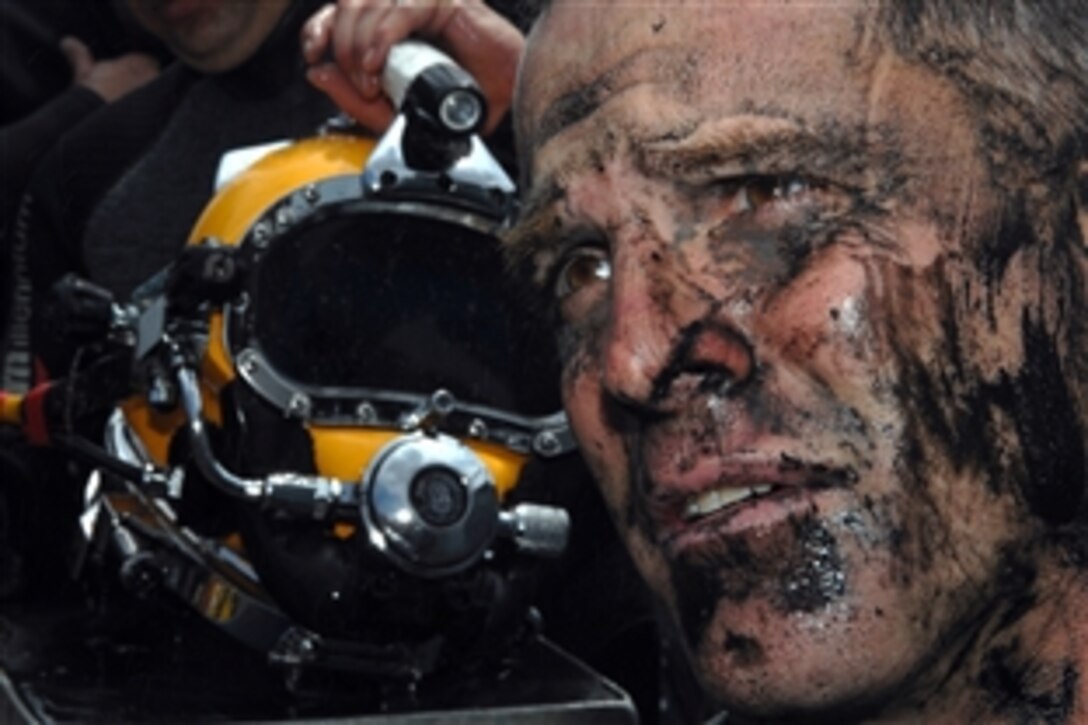 U.S. Navy Petty Officer 1st Class Mark Sawyer returns from a diving mission in Providence River to conduct salvage operations on the sunken former Soviet submarine Juliett 484, July 7, 2008. Sawyer completed a dive that required tunneling in the mud underneath the former Soviet submarine which is off the coast of Providence, R.I. Sawyer is assigned to the Mobile Diving and Salvage Unit Two, Company 21.