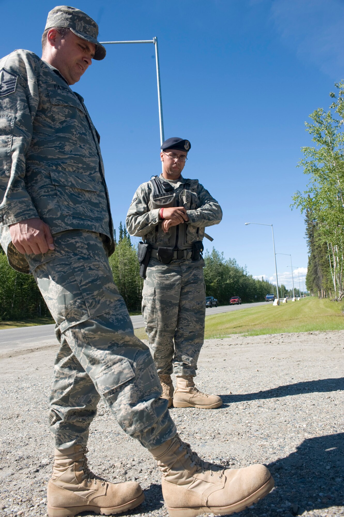 EIELSON AIR FORCE BASE, Alaska --Master Sgt. Brian Fairchild, 354th Medical Operations Squadron, plays the roll of "That Guy" a drunk driver pulled over and put through a series of sobriety tests July 2, 2008. An Airman from the 354th Security Forces Squadron watches and times Sergeant Fairchild as he stands on one foot to test his balance while acting intoxicated.
  (U.S. Air Force photo by Airman 1st Class Christopher Griffin)(RELEASED)