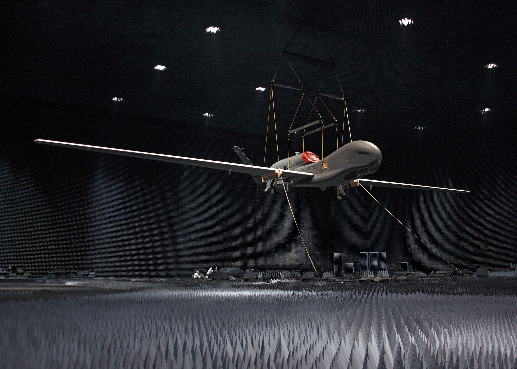 A full RQ-4 Global Hawk Block 20 aircraft hangs inside the Benefield Anechoic Facility here June 30 during electromagnetic profile testing. (Air Force photo by Jet Fabara)