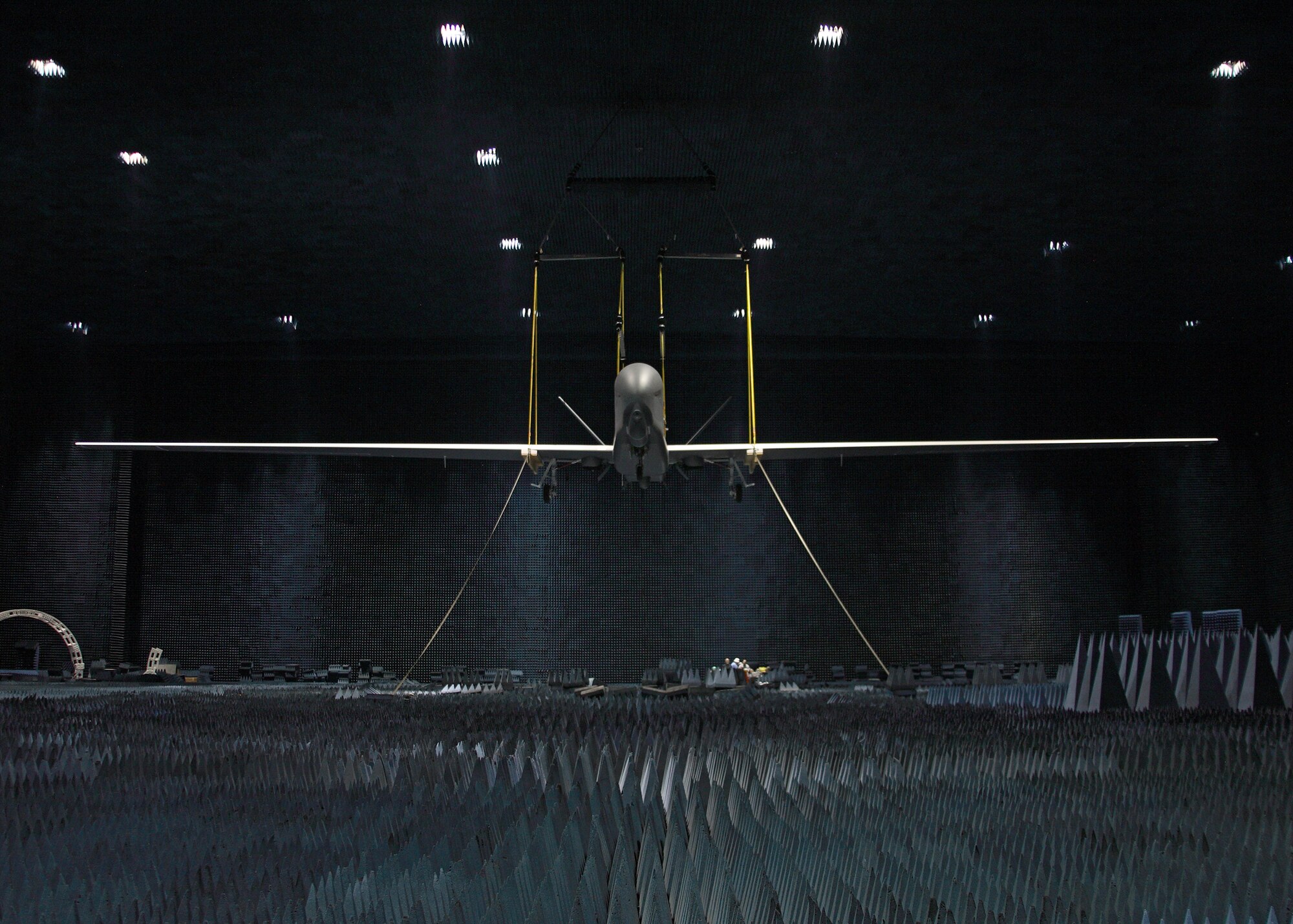A full RQ-4 Global Hawk Block 20 aircraft hangs inside the Benefield Anechoic Facility here June 30 during electromagnetic profile testing. The Global Vigilance Combined Test Force concluded the testing July 3. (Air Force photo by Jet Fabara)