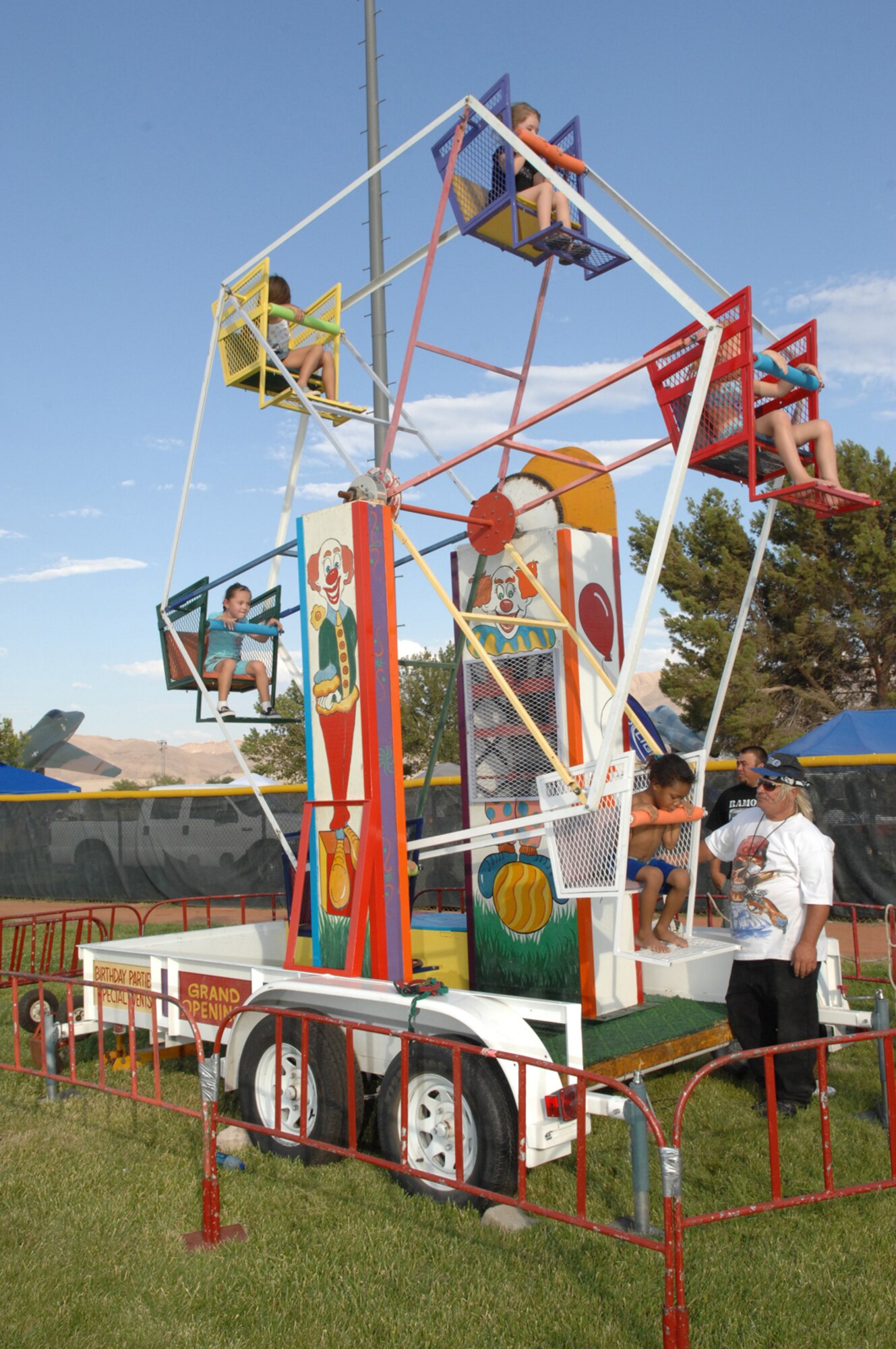 Children in attendance of the Freedom fest event enjoy a ride at Freedom park July 4, 2008 Nellis Air Force Base, Nev.
(U.S. Air Force Photo by Senior Airman Larry E. Reid Jr.)