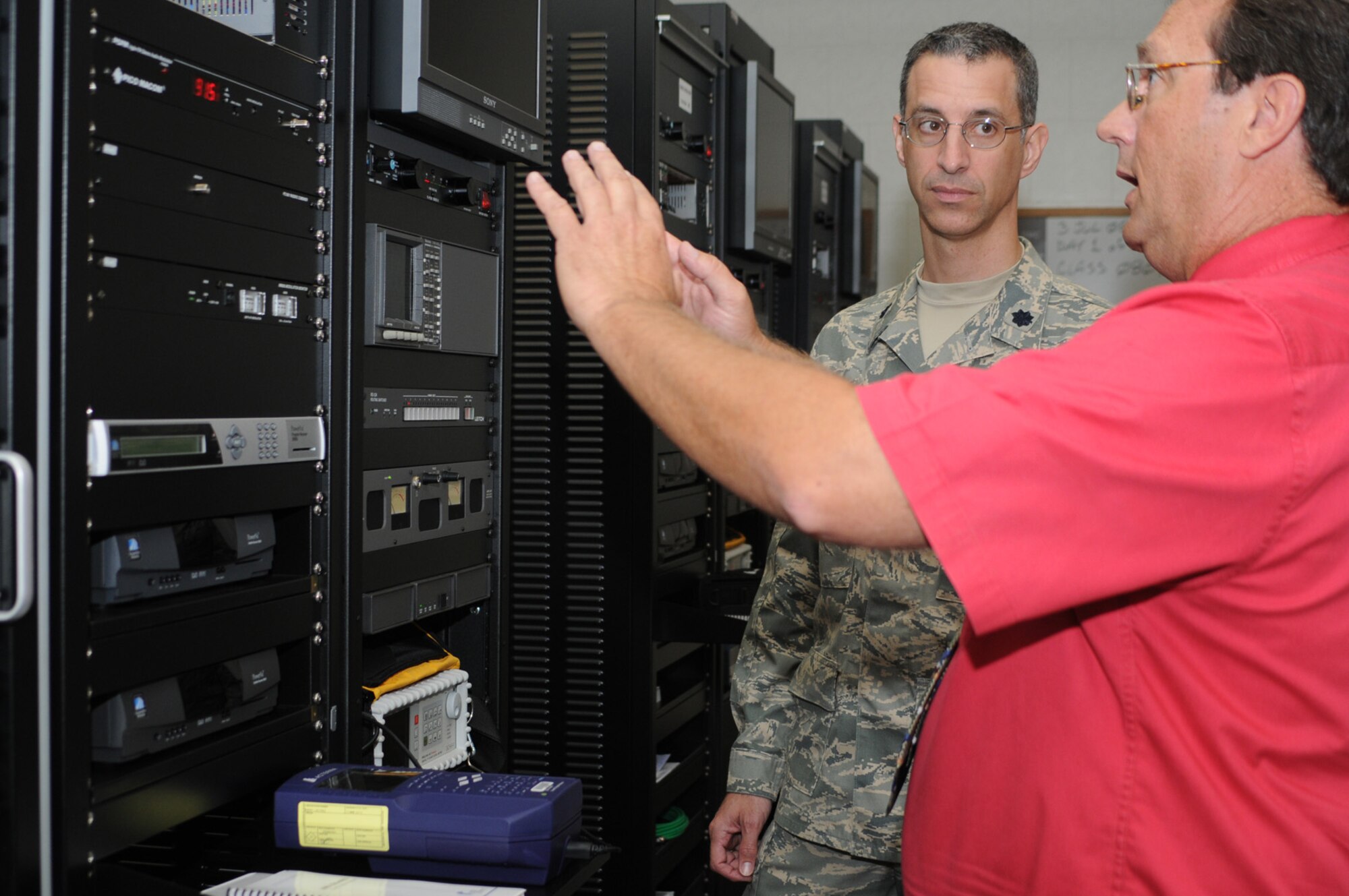 Lt. Col. John Thomas, new commander of the 338th TRS, learns about the equipment used in the visual imagery and intrusion detection systems course from instructor Mark Kolath.  (U.S. Air Force photo by Kemberly Groue)