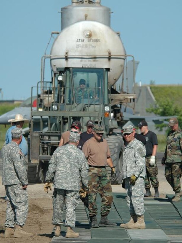 N.D. Air and Army National Guard members work to set up railcars donated by Burlingon Northern Santa Fe Railroad on Wed. Jul 9, 2008 at the 119th Wing, N.D. Air National Guard.  The two railcars will be used for training at the N.D. Air National Guard base.  