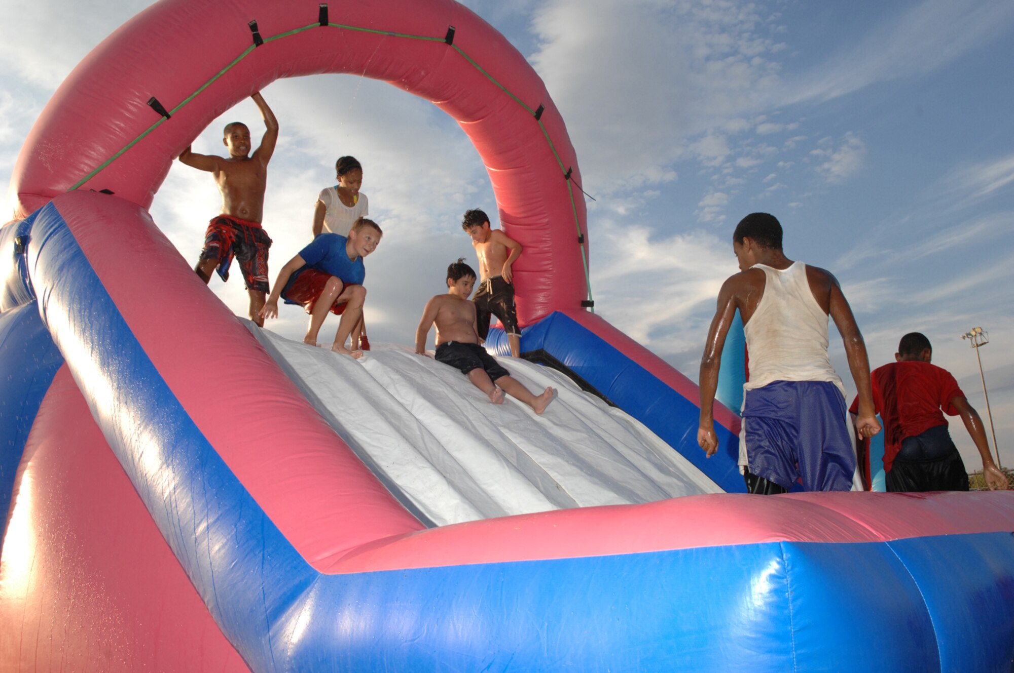 Children in attendance of the Freedom fest event slide down an inflatable water slide at Freedom park July 4, 2008 Nellis Air Force Base, Nev.
(U.S. Air Force Photo by Senior Airman Larry E. Reid Jr.)