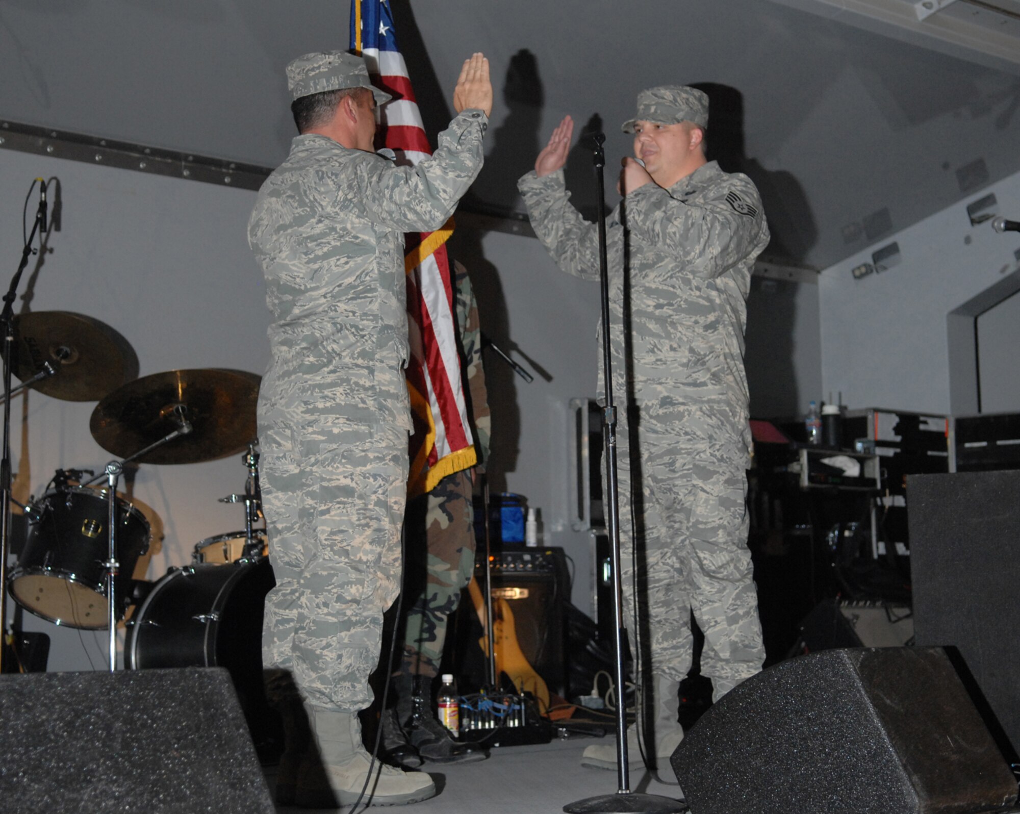 Col. Russell Handy, 57th Wing Commander, re-enlists Staff Sgt. Christopher Calloway, 57th Weapons Support Squadron Command Support Staff member, during the Freedom fest event at Freedom park July 4, 2008 Nellis Air Force Base, Nev.
(U.S. Air Force Photo by Senior Airman Larry E. Reid Jr.)